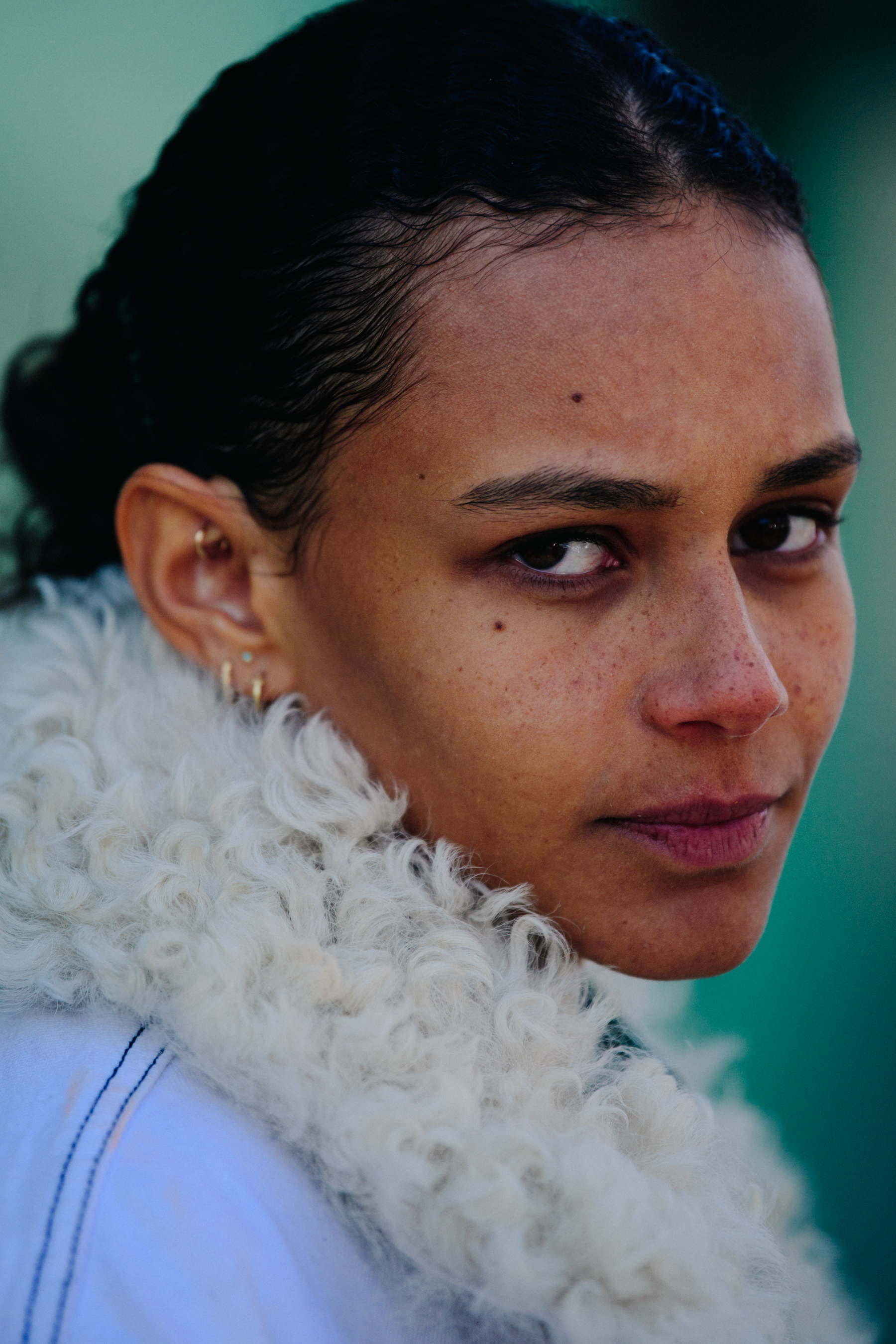 Portrait of model wearing white fur collar