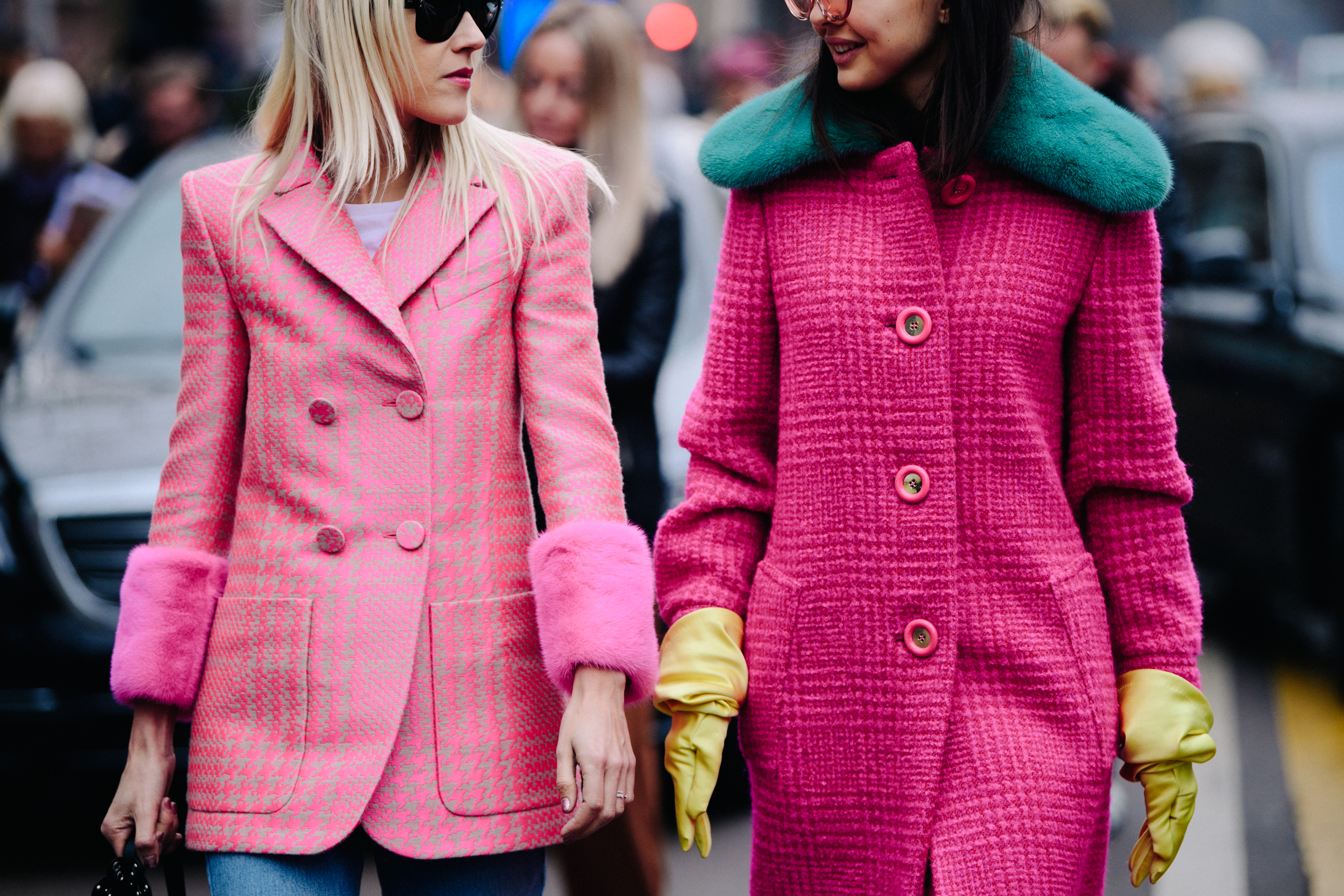 Two women wearing pink outfits