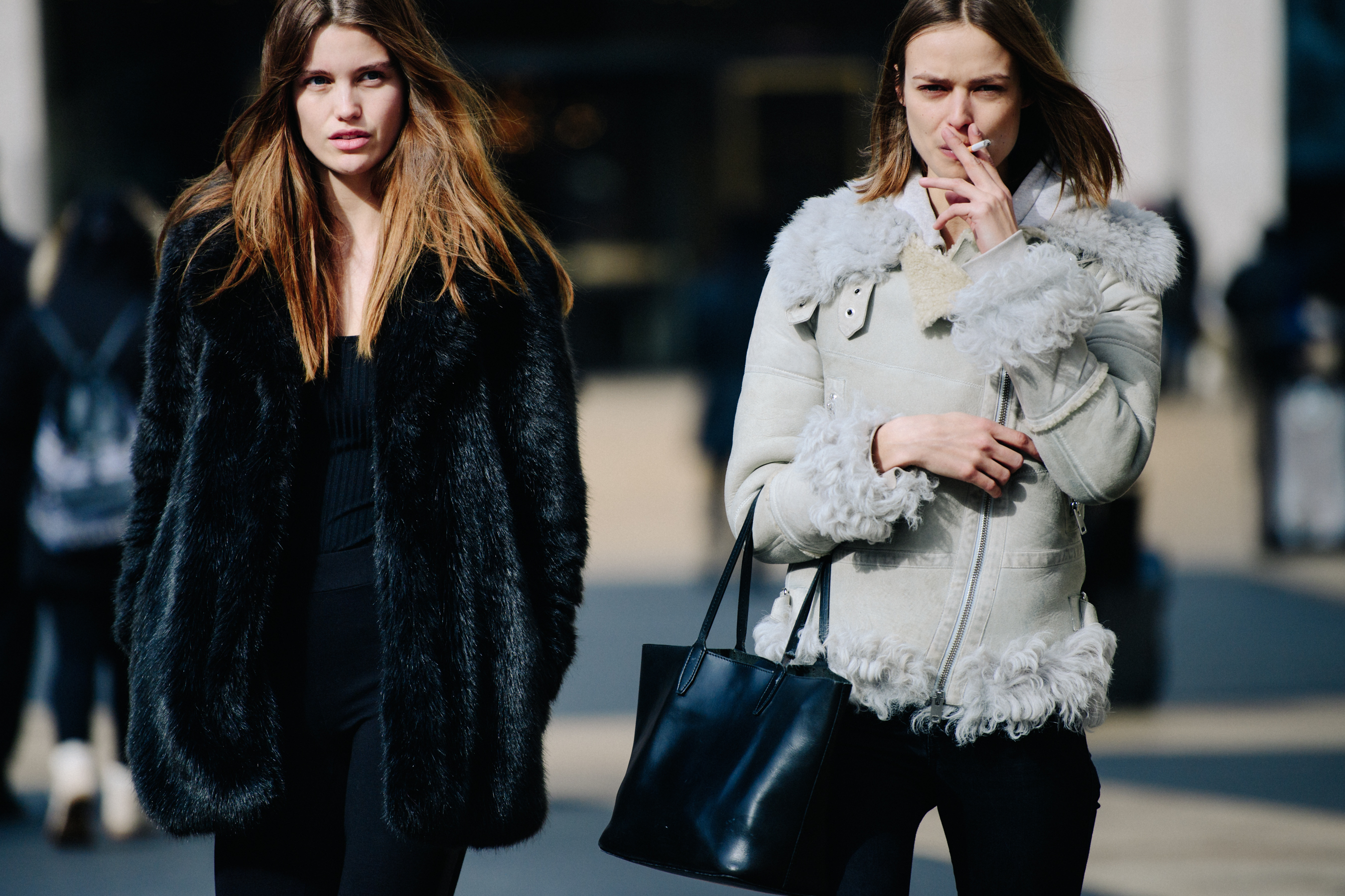 Two Dutch models wearing fur coats
