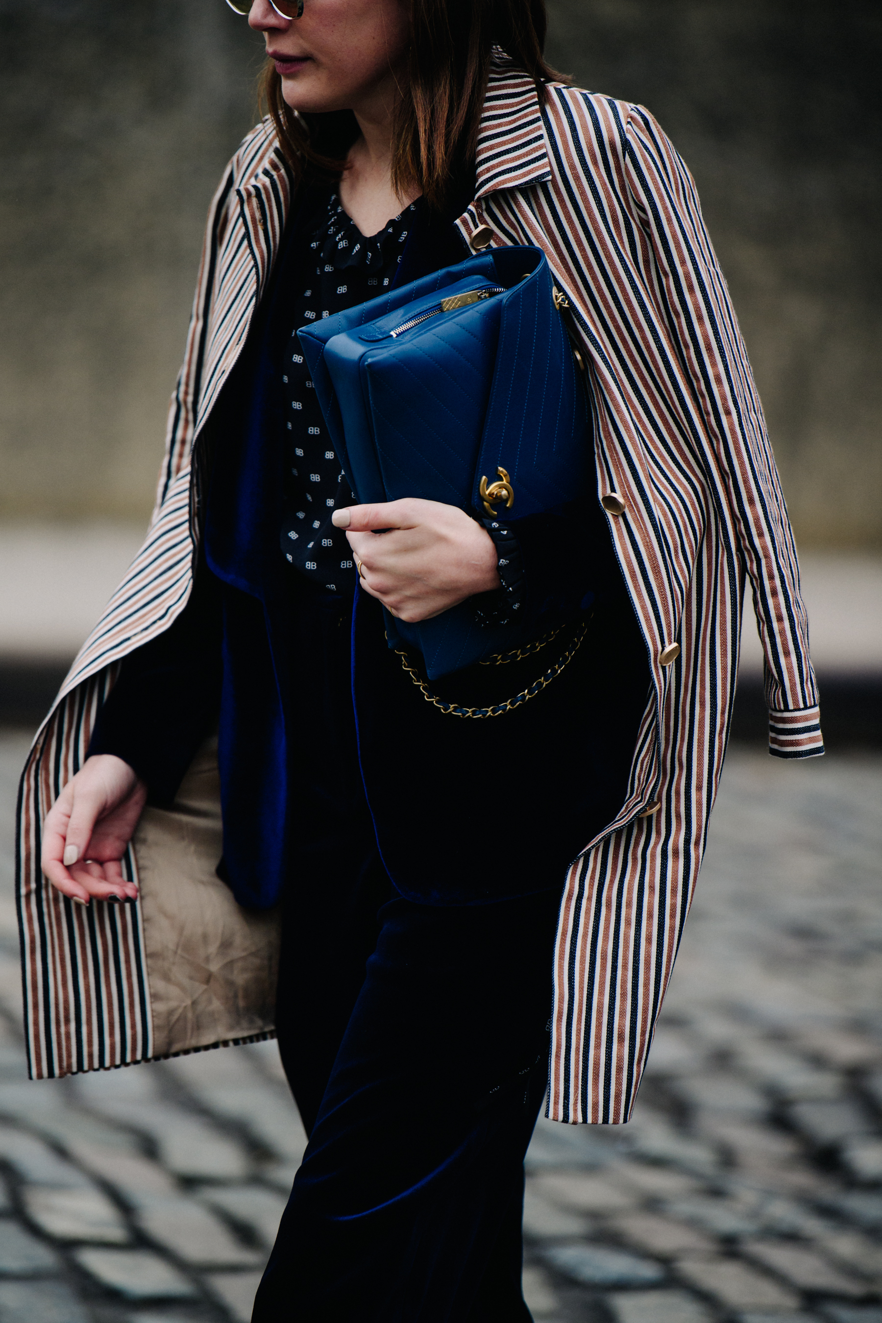 Woman carrying blue Chanel bag