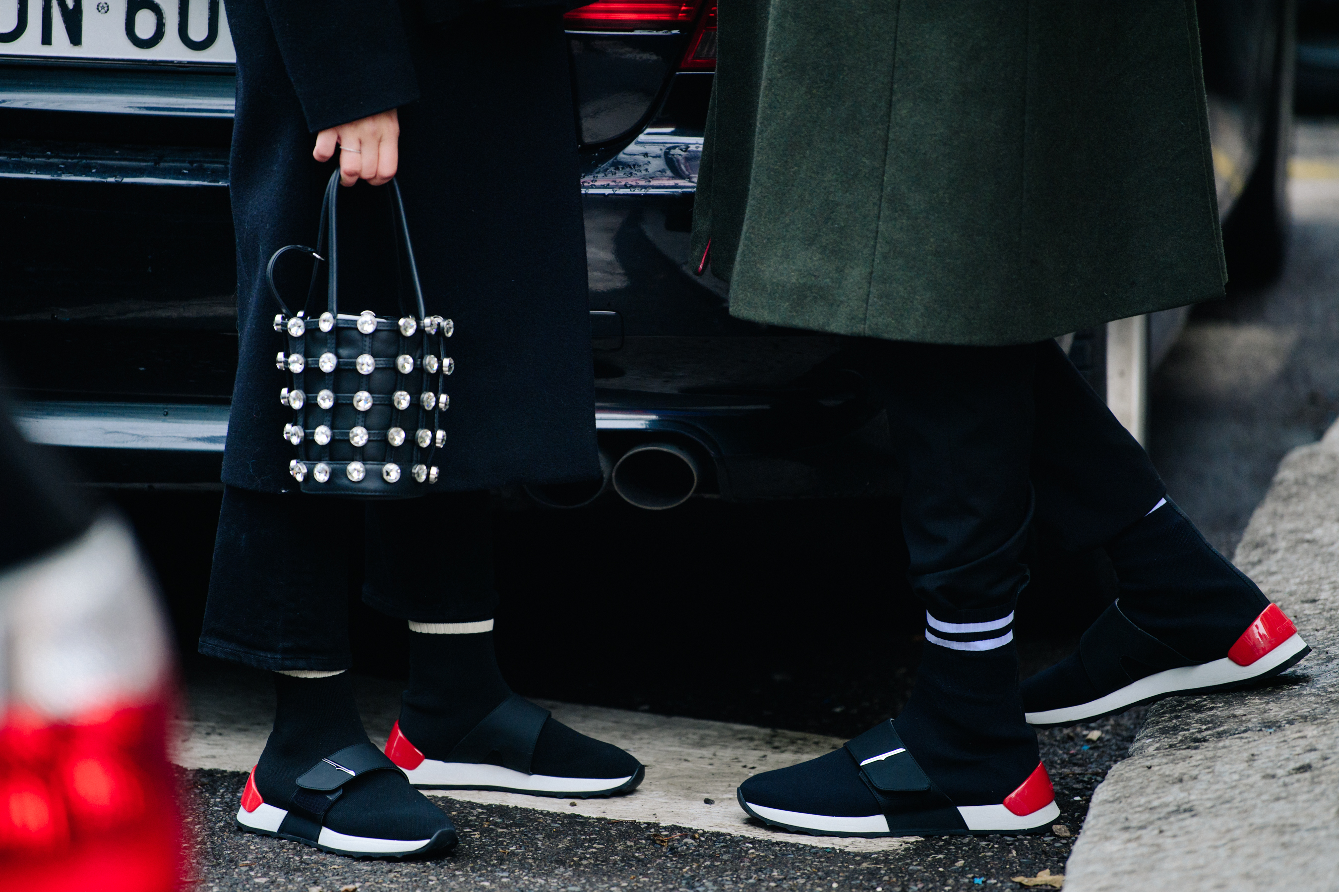 Couple wearing matching sneakers