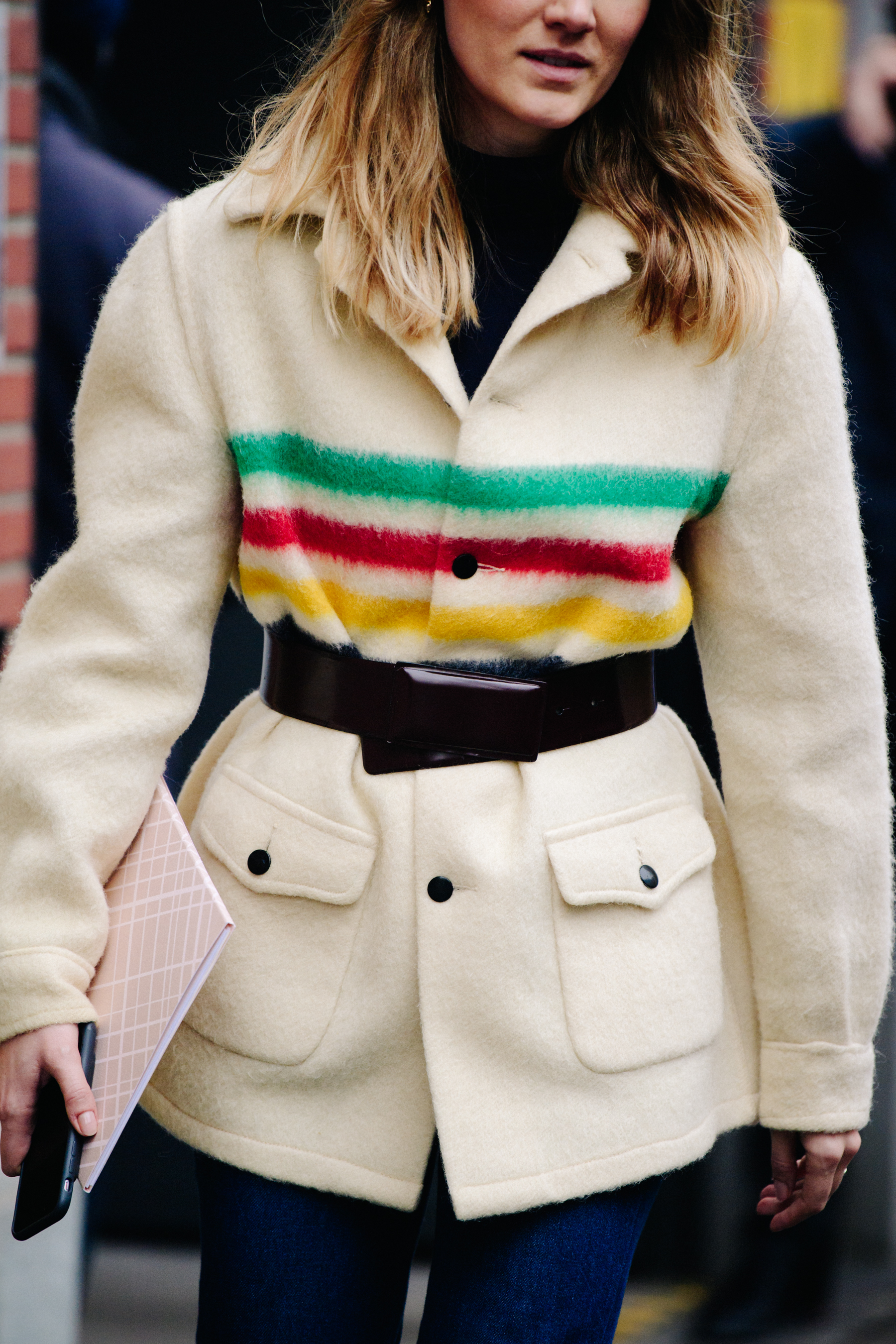 Woman wearing coloured stripe jacket
