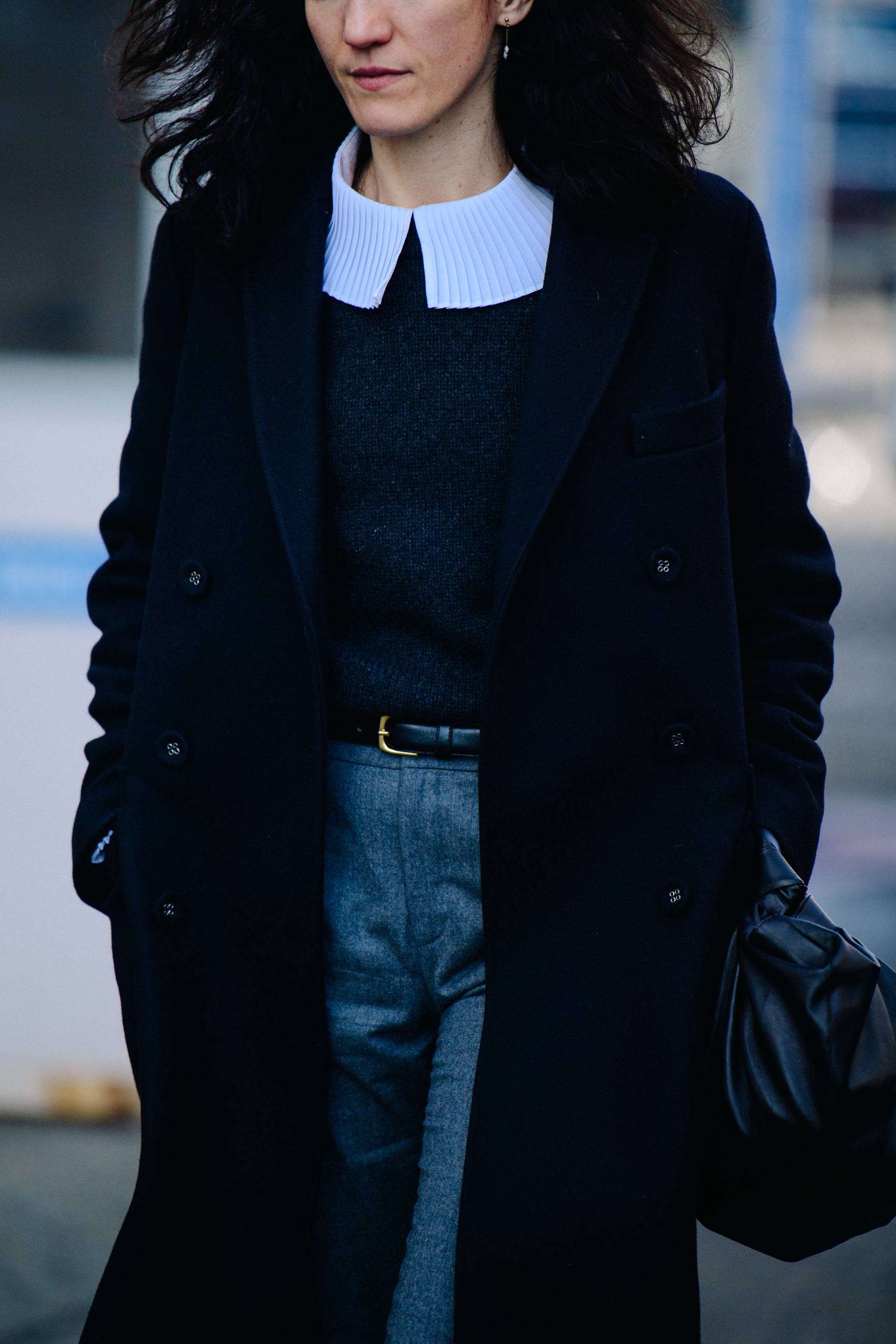 Woman wearing grey suit trousers