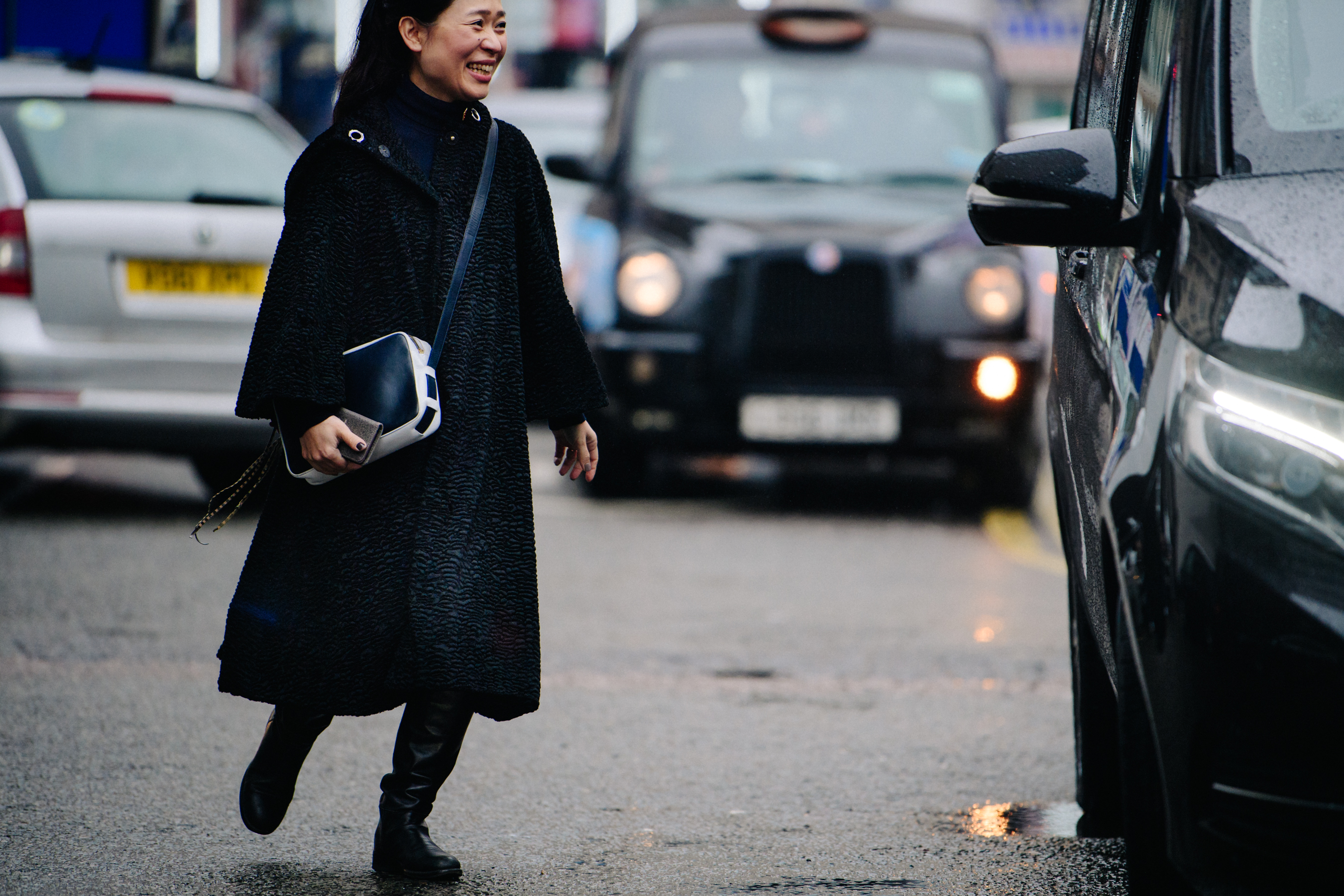 Woman wearing long black coat