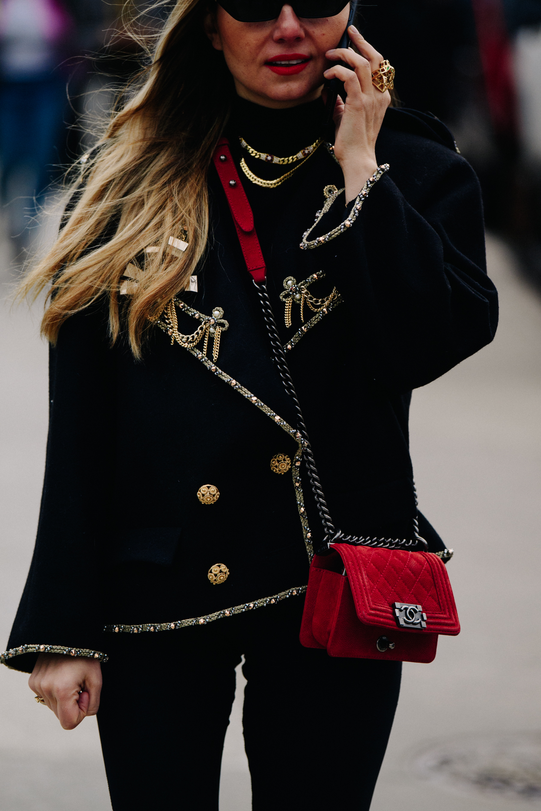 Woman wearing red Chanel bag