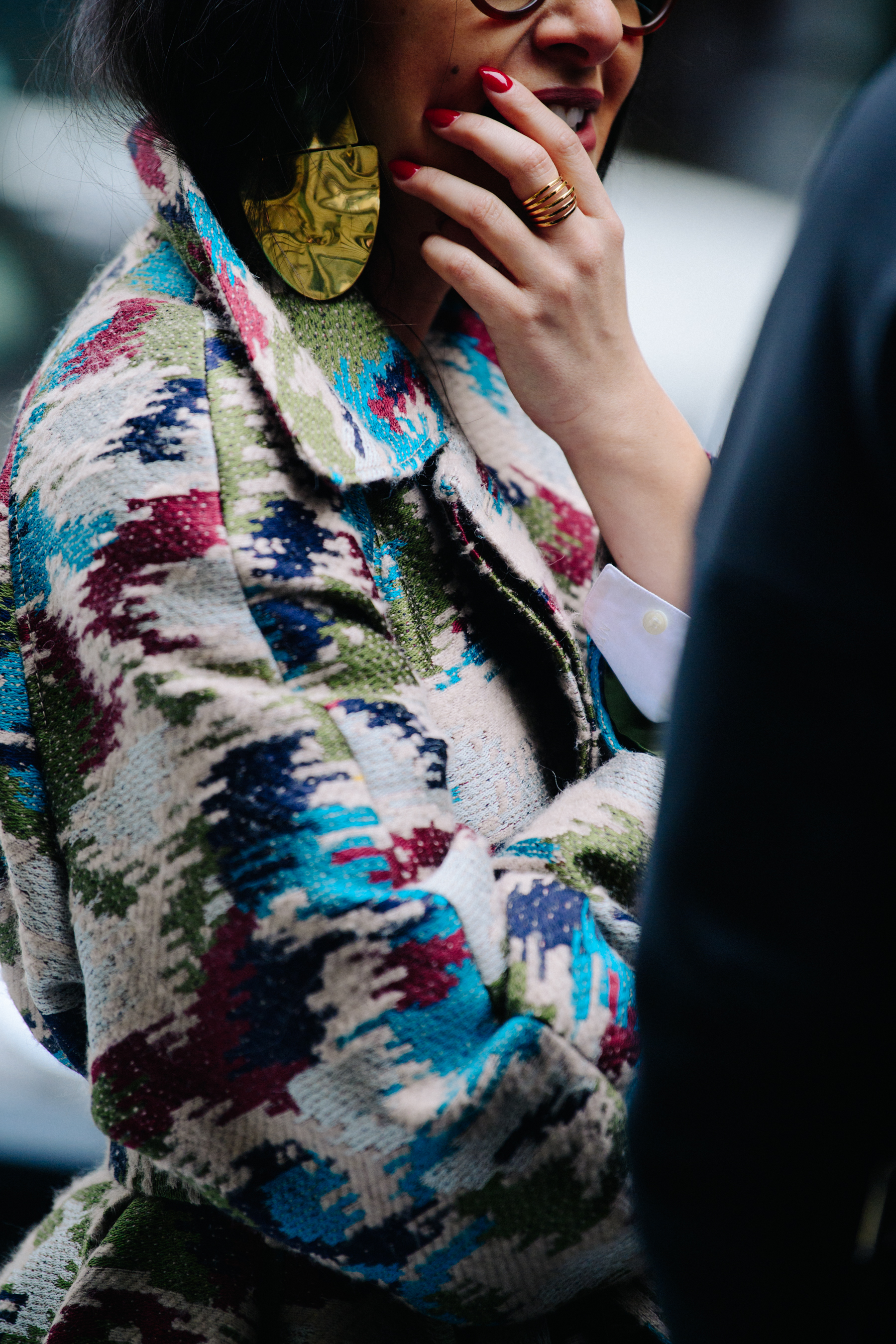 Woman wearing multicoloured coat