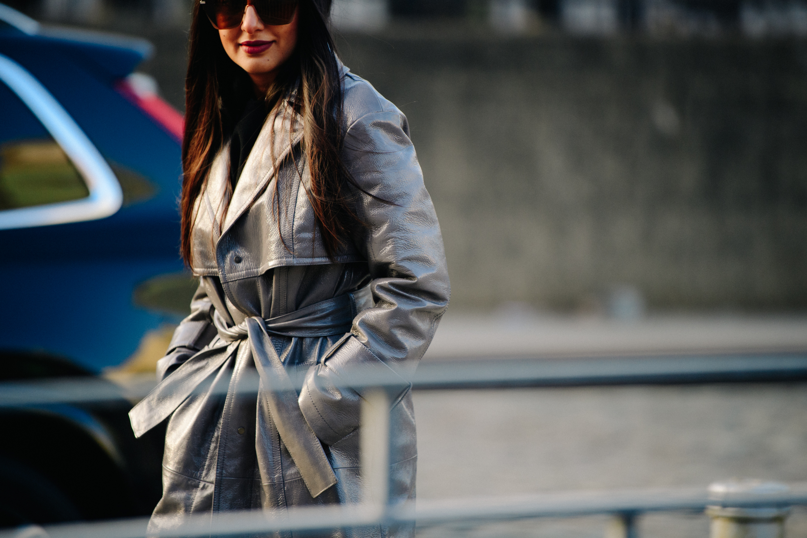 Woman wearing grey leather coat