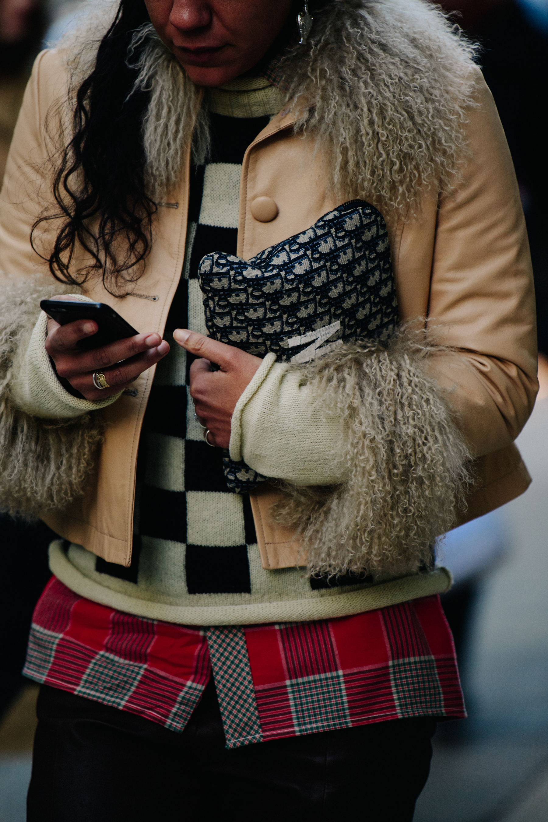 Woman wearing light brown jacket