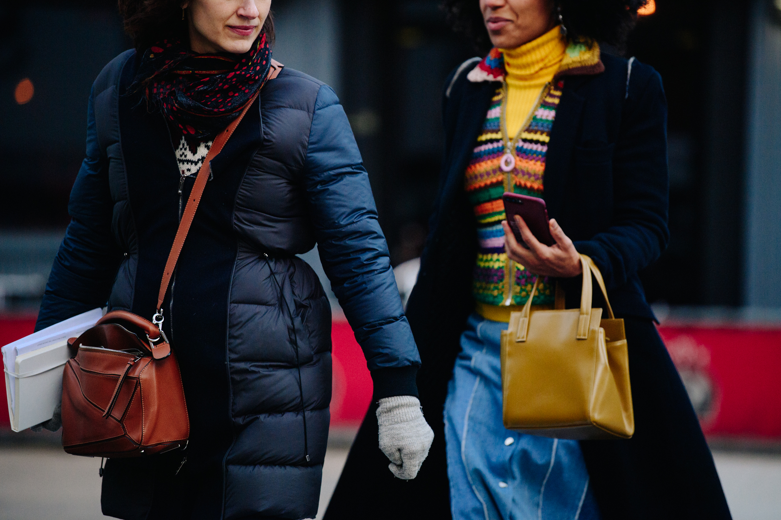 Two women wearing winter coats