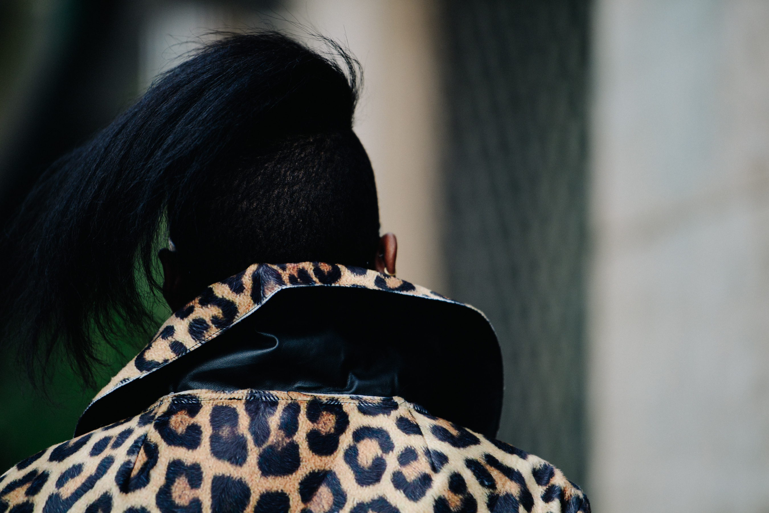 Woman wearing animal print raincoat