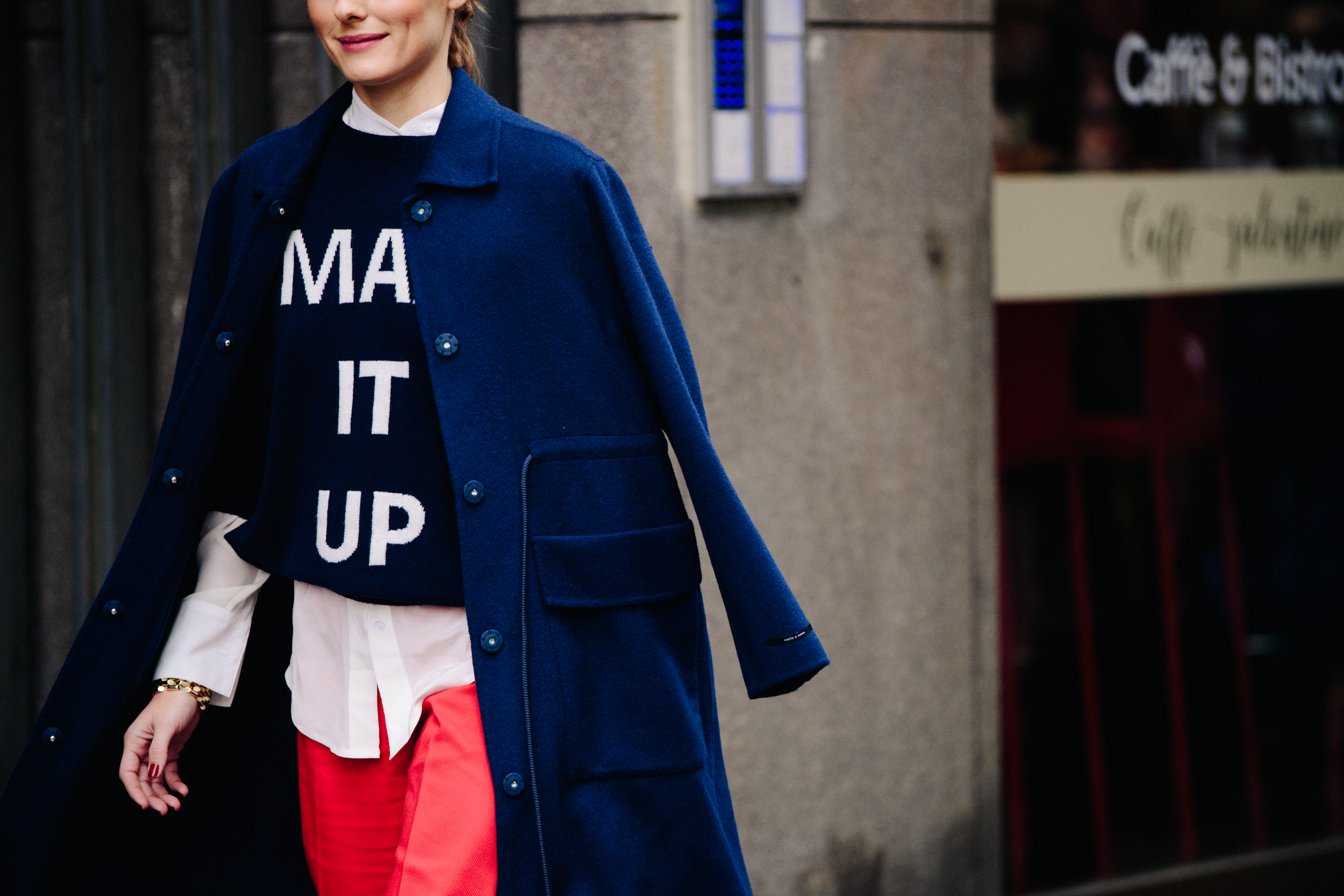 Woman wearing long blue wool coat