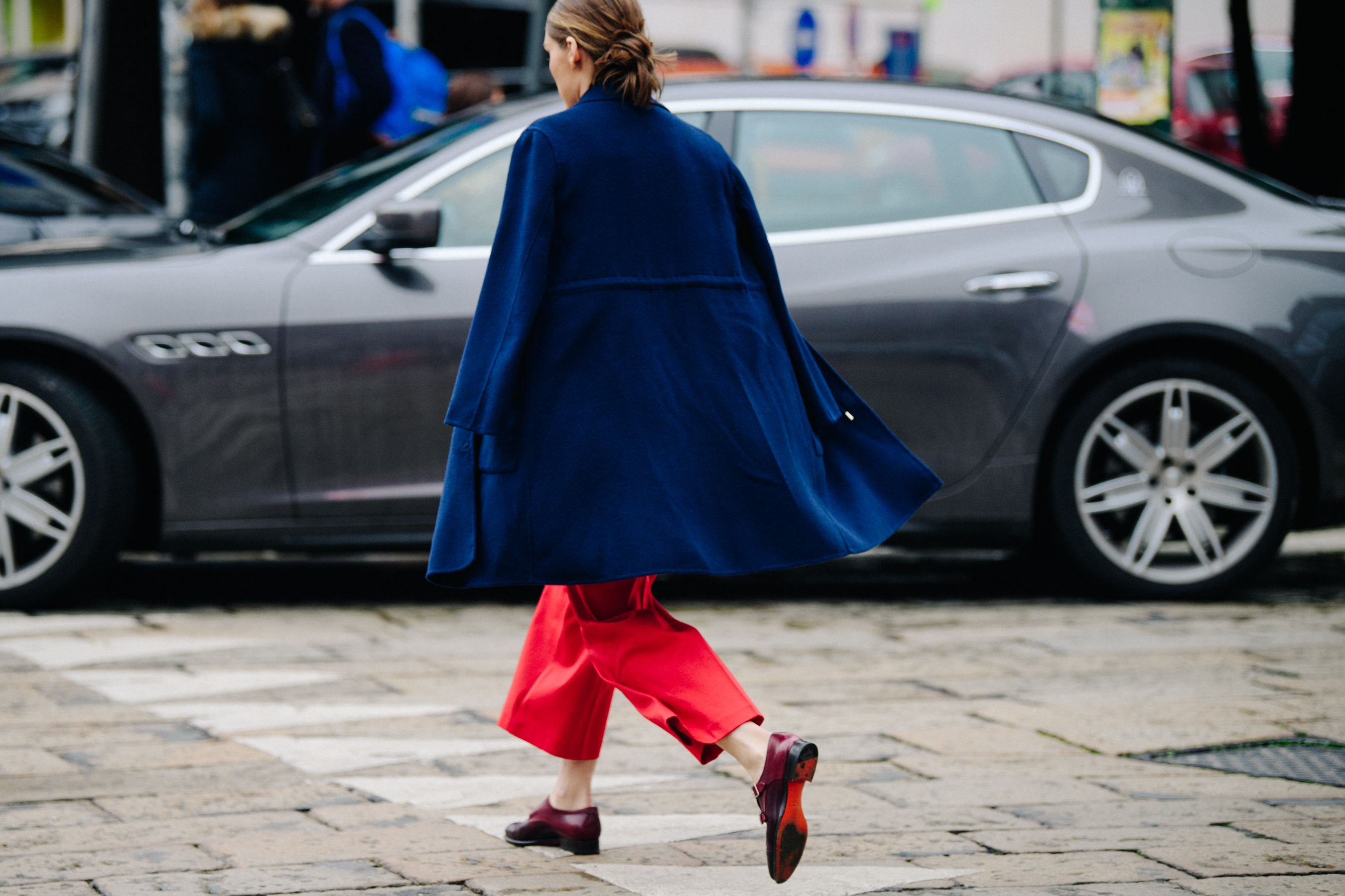 Woman wearing long blue wool coat