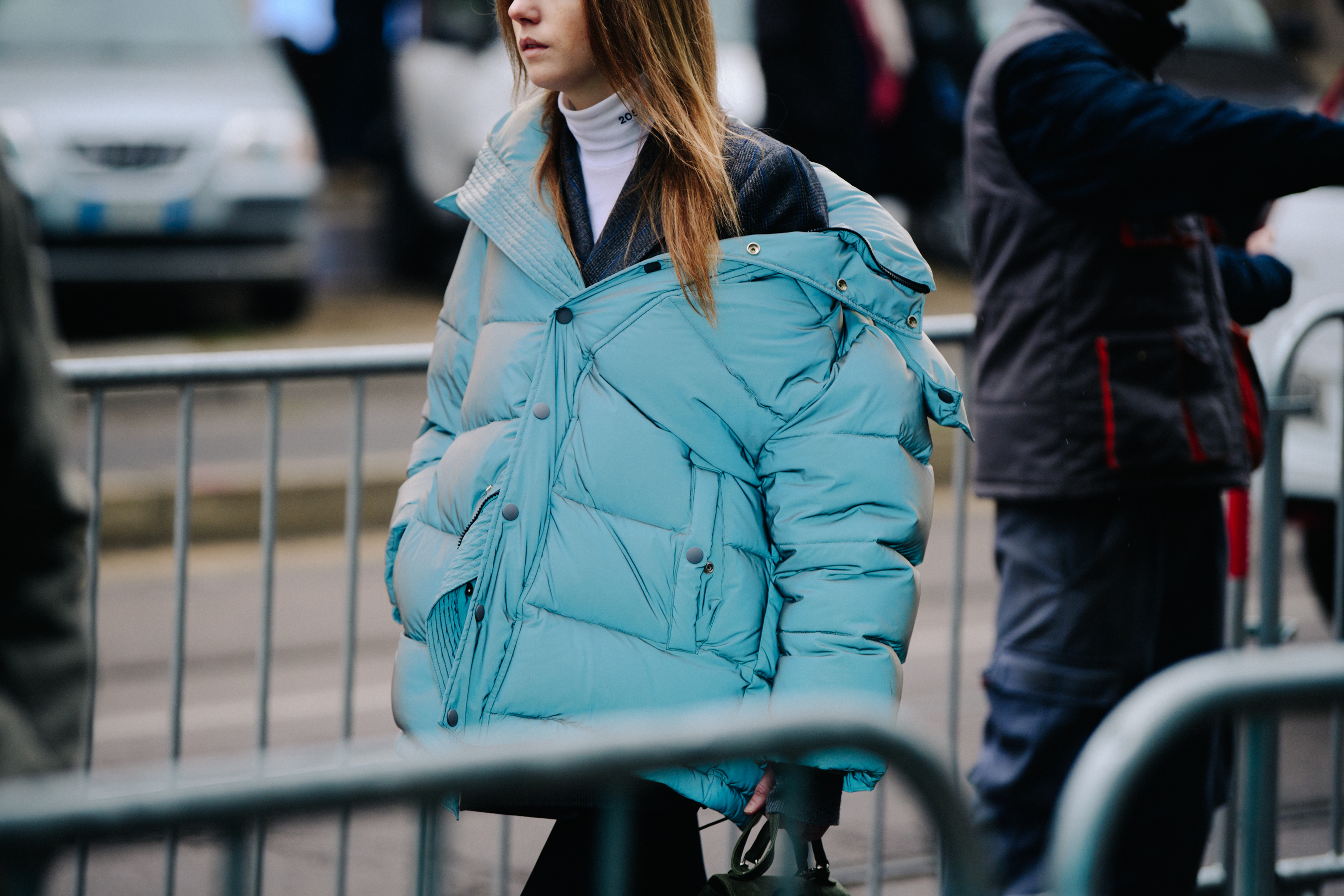 Woman wearing blue reflective jacket