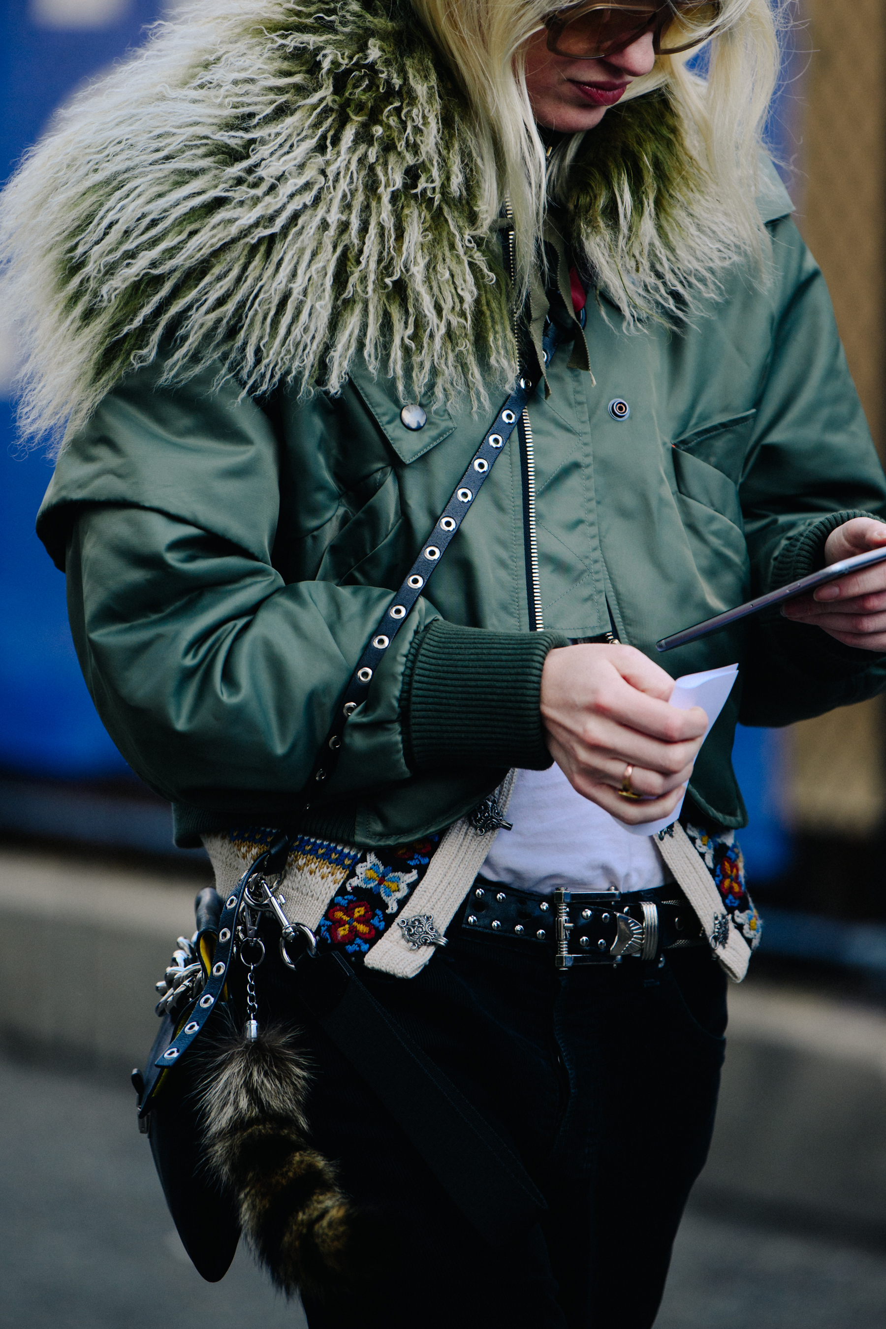 Woman wearing green bomber jacket