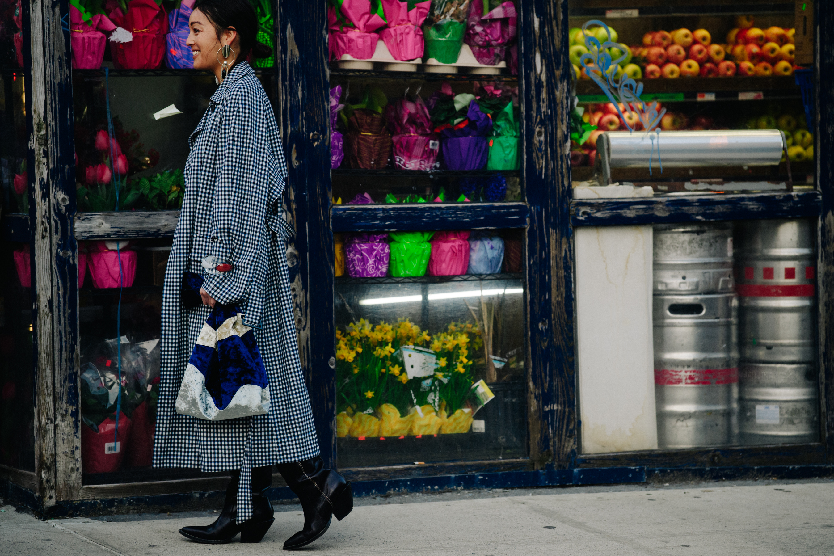 Woman wearing white and black check coat