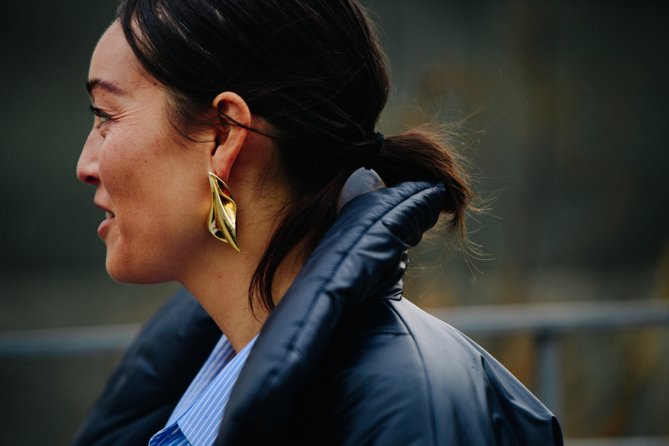 Woman wearing gold earrings