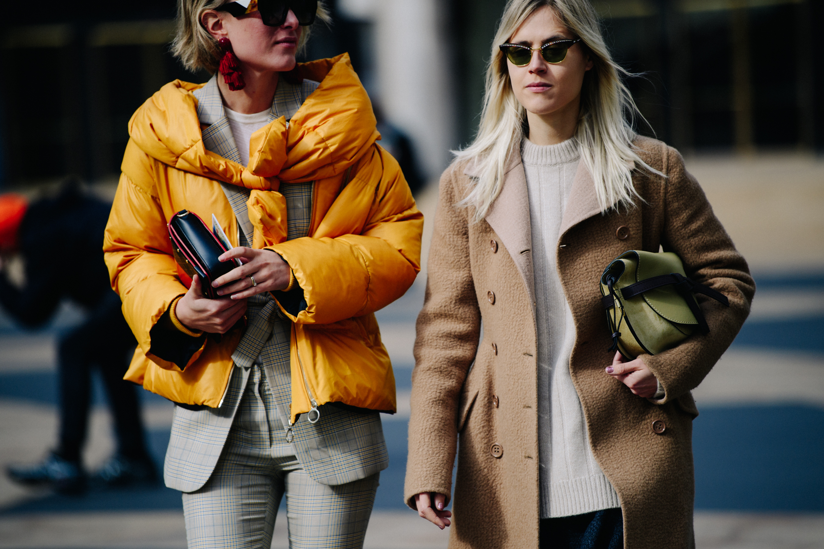 Two women wearing light colour jackets
