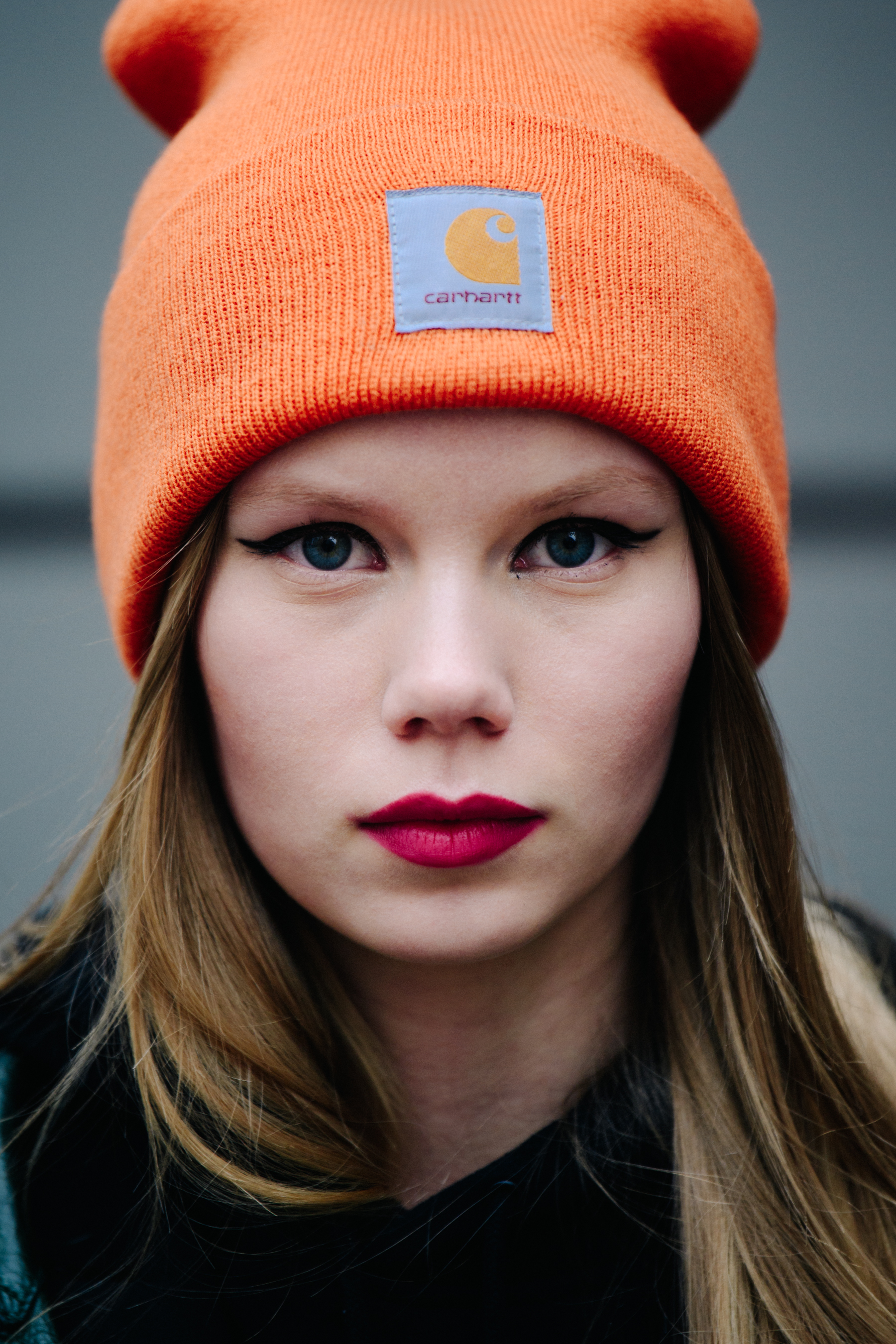 Portrait of Danish model wearing orange beanie