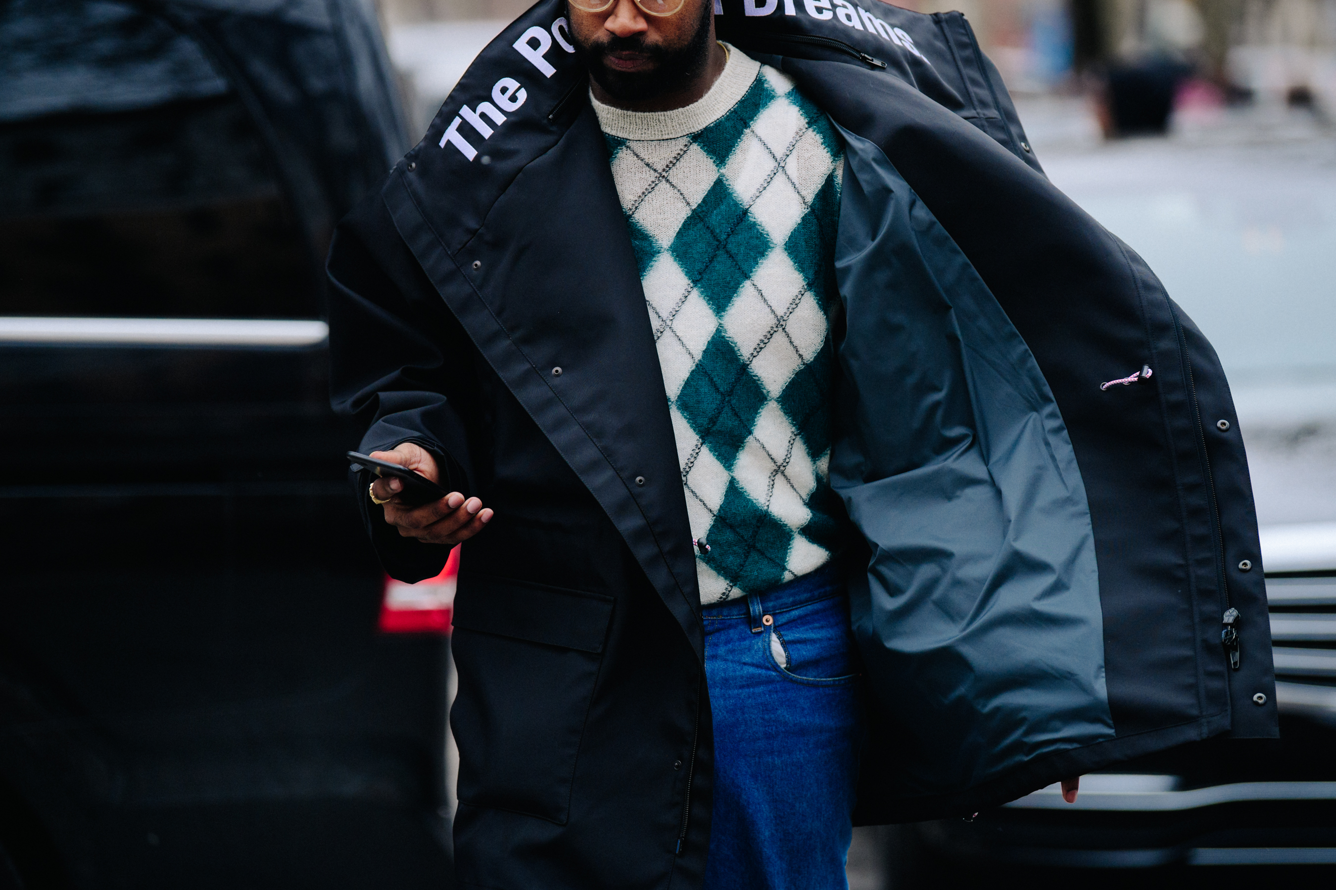 Man wearing black waterproof coat