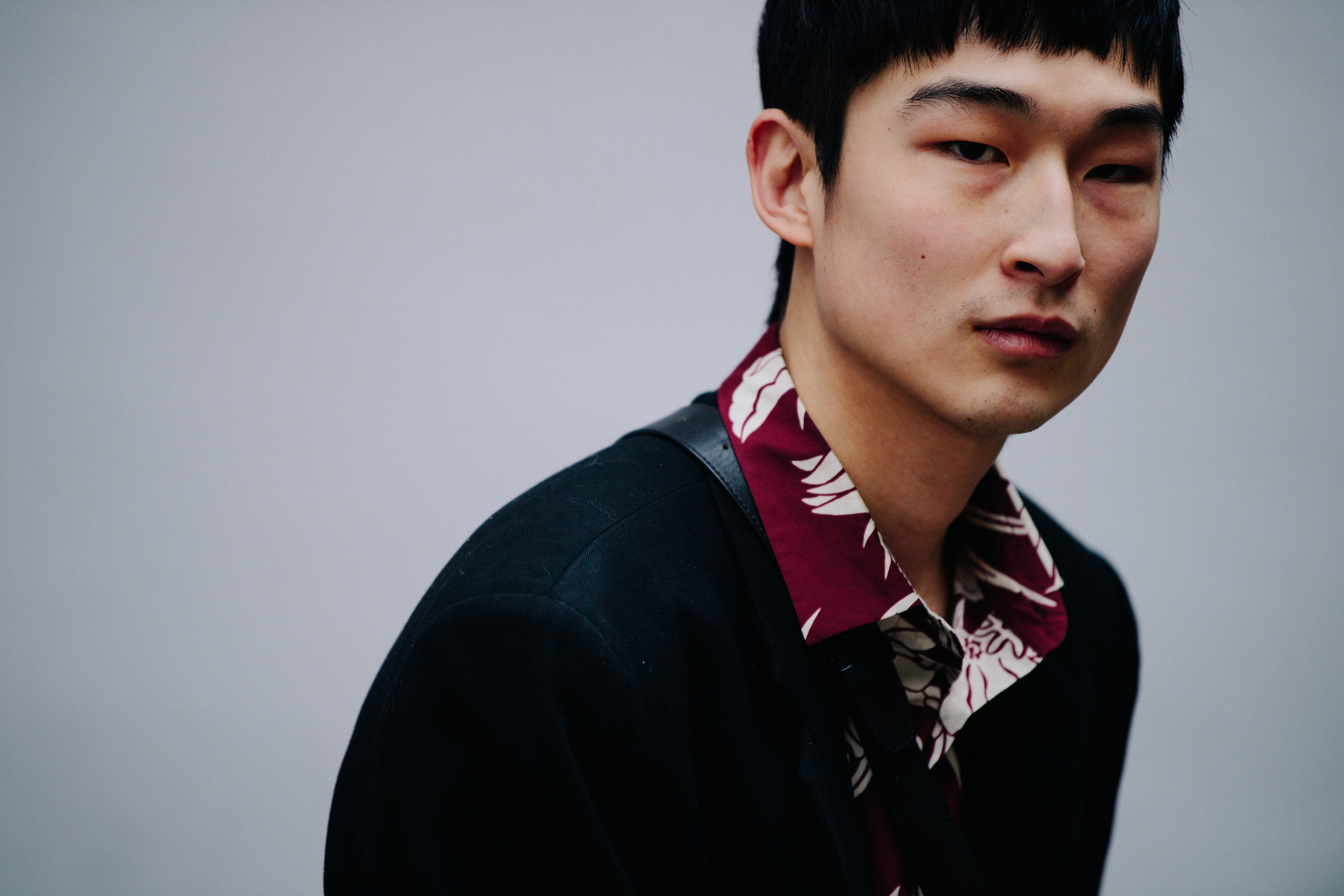Chinese model wearing floral shirt