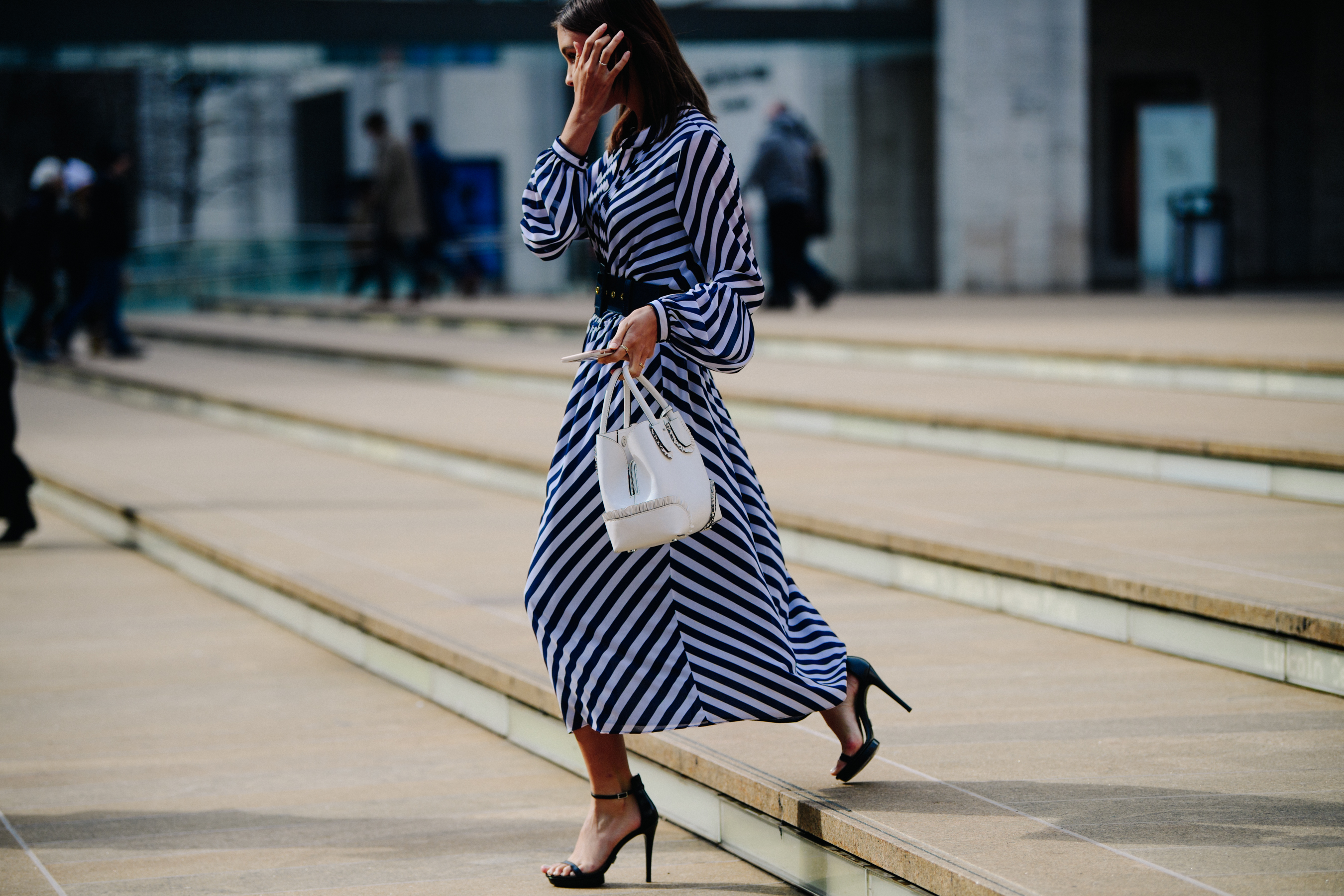 Woman wearing black and white striped dress