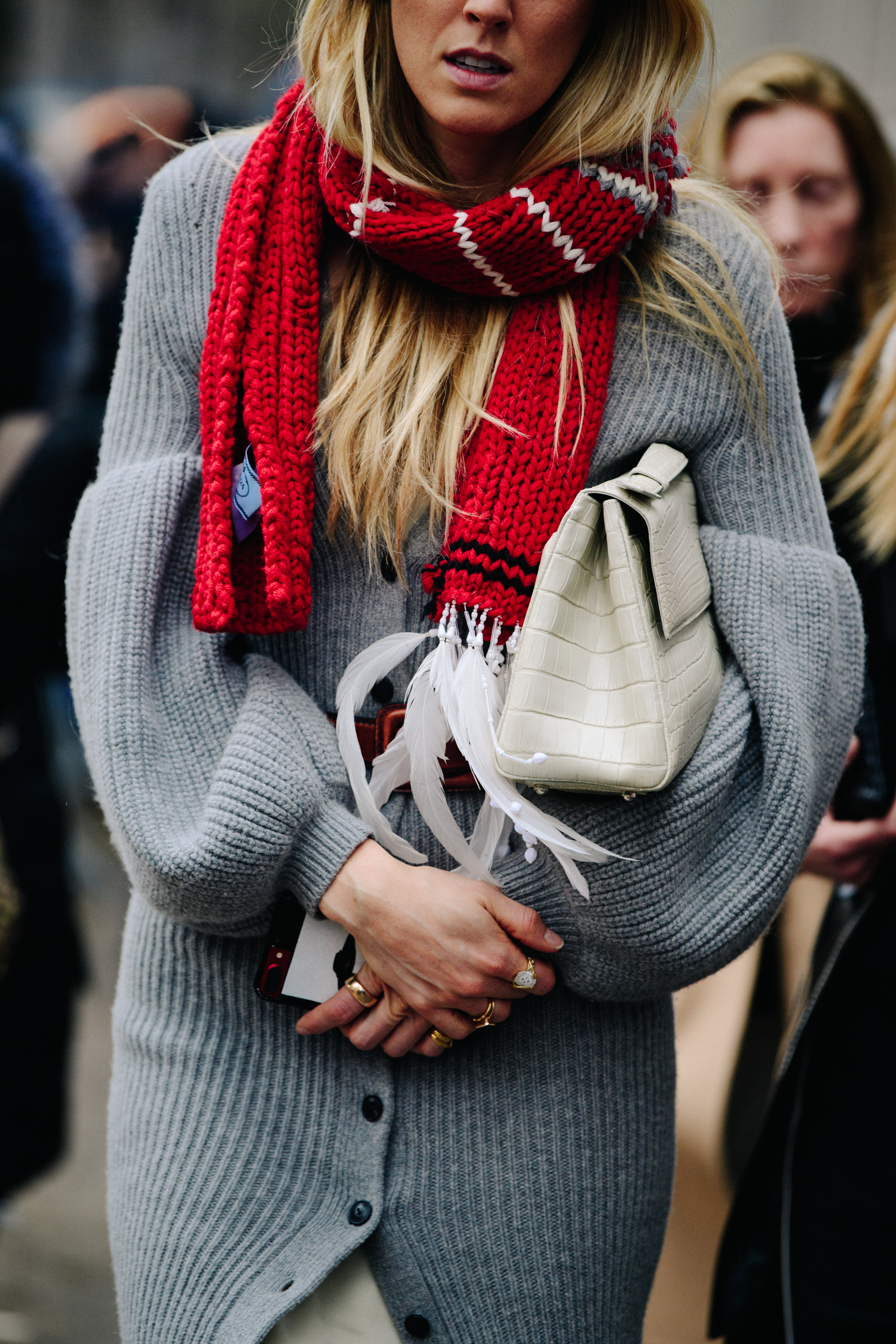 Woman wearing grey knitted jacket