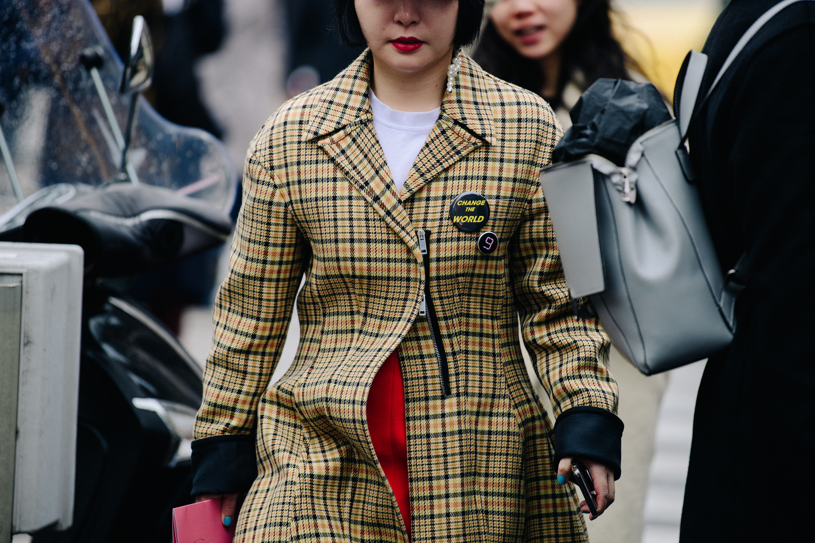 Woman wearing yellow check coat