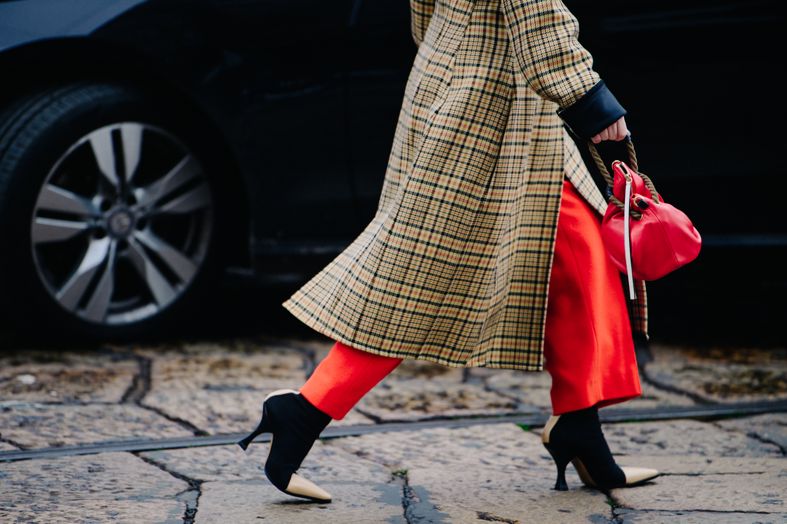Asian woman wearing red pants