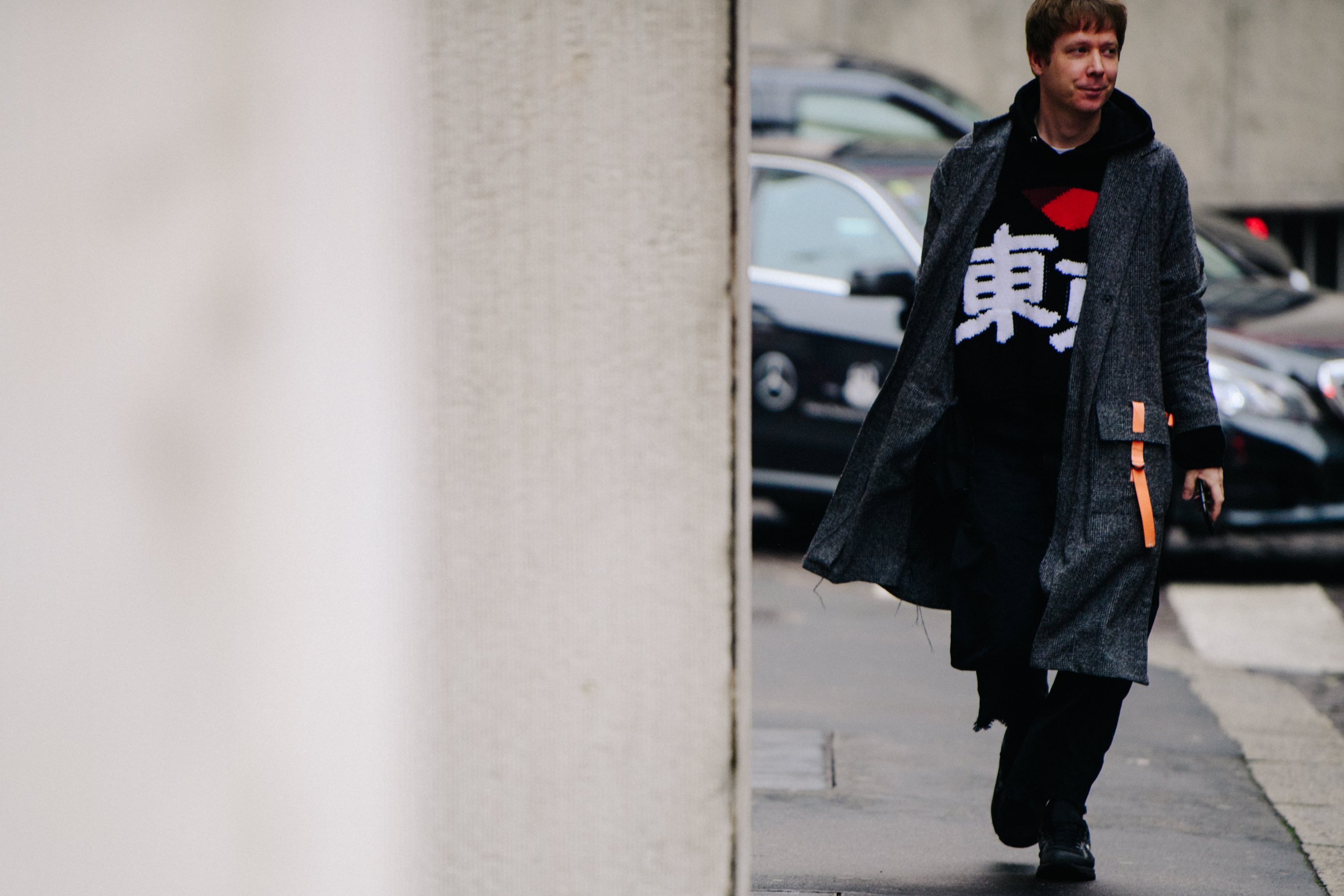 Man wearing long grey coat