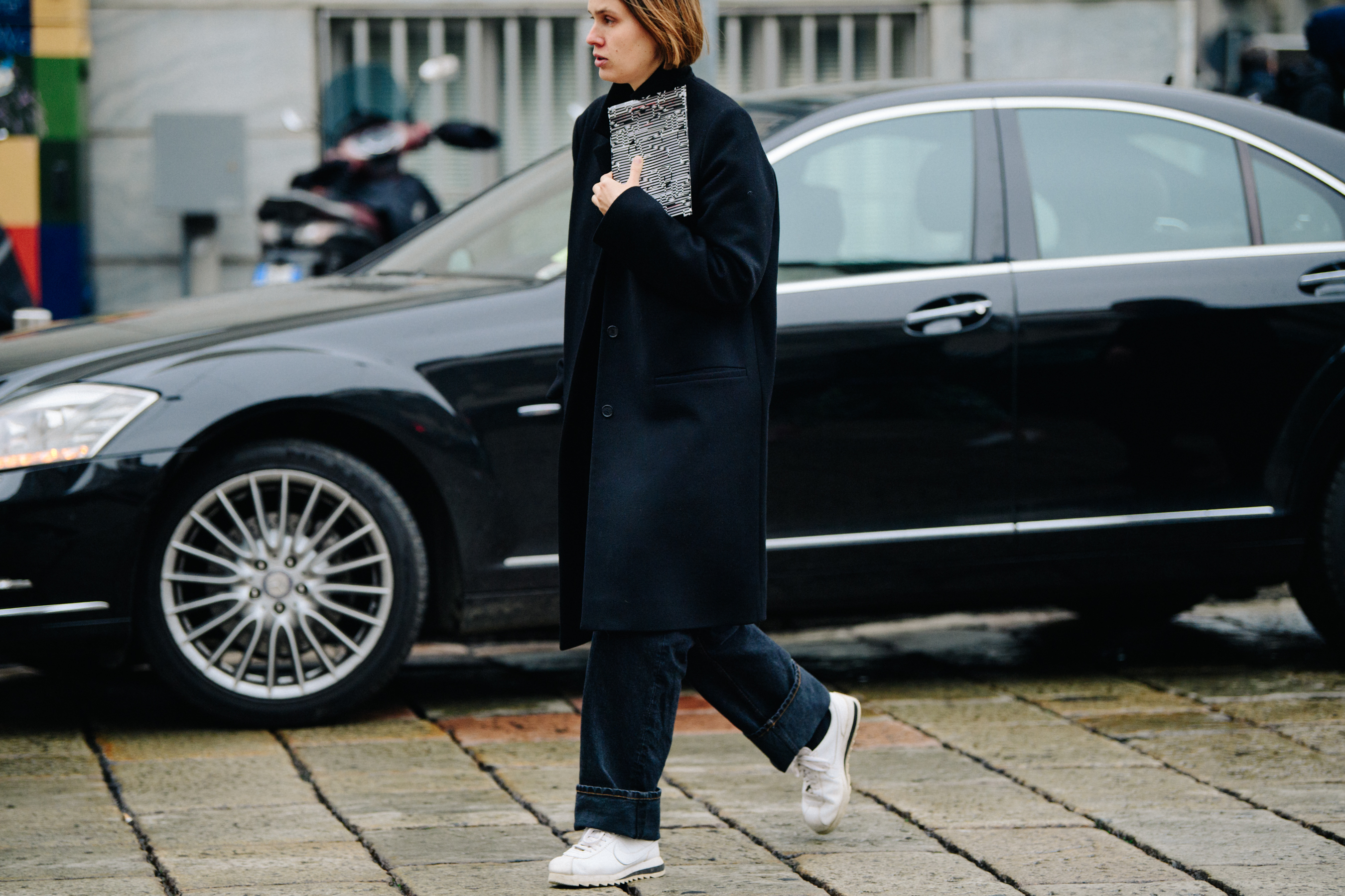 Woman wearing long black coat
