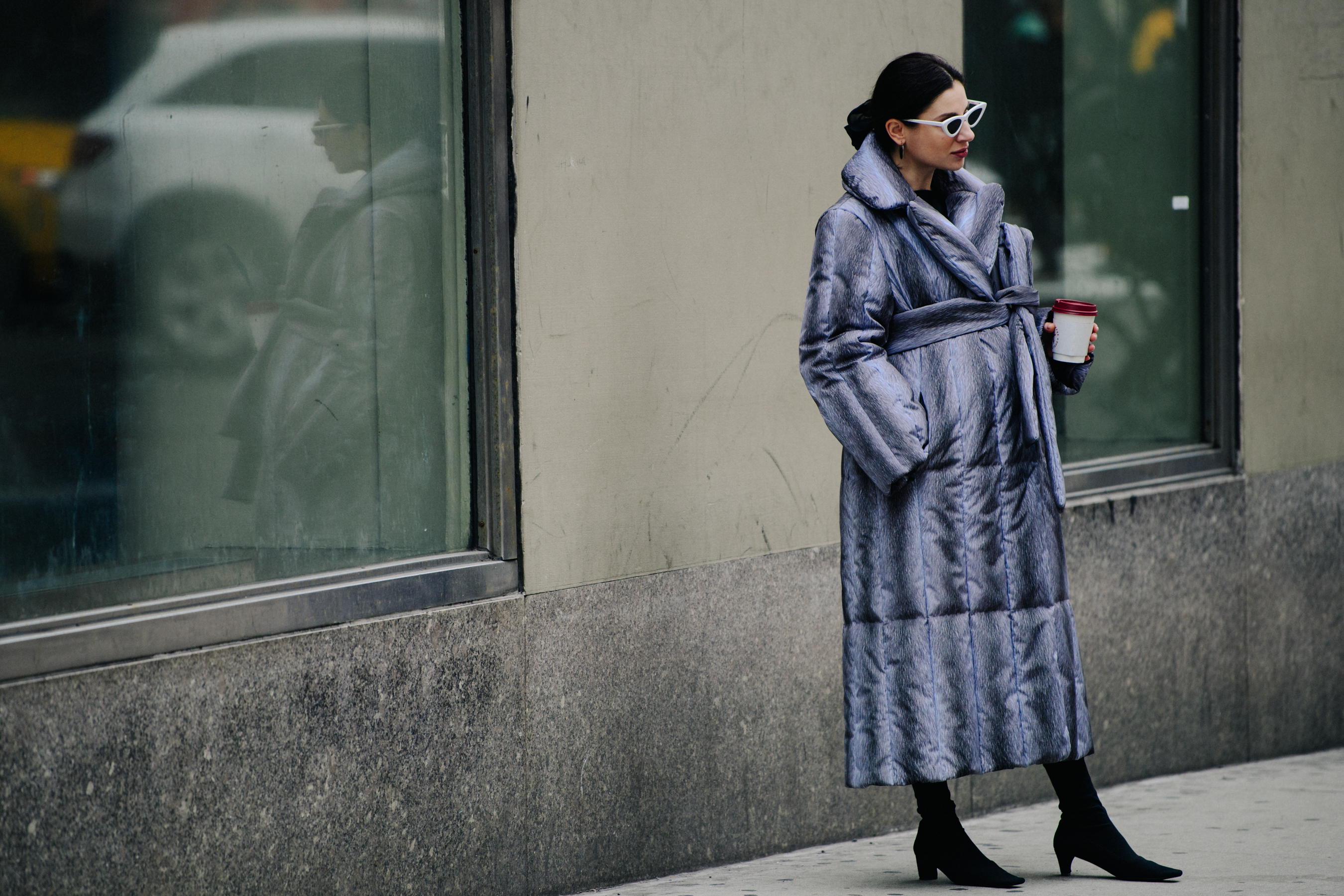 Woman wearing long grey coat
