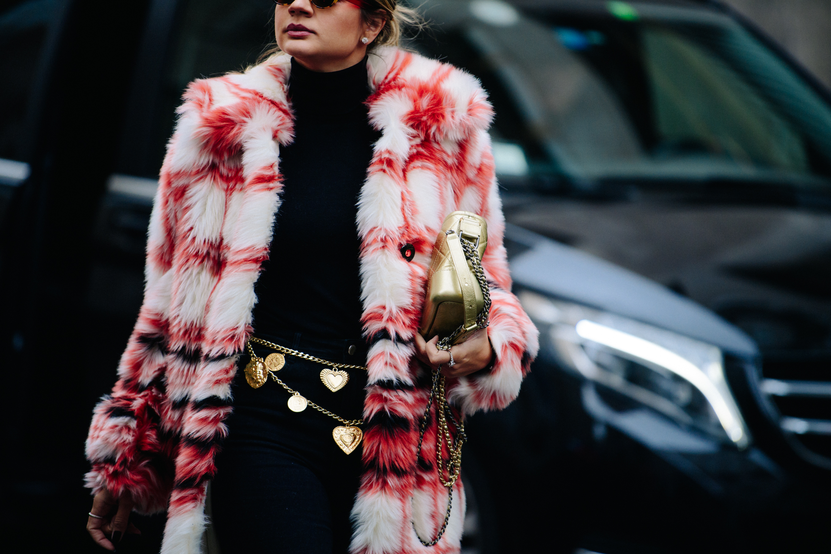 Woman wearing red and white fur coat