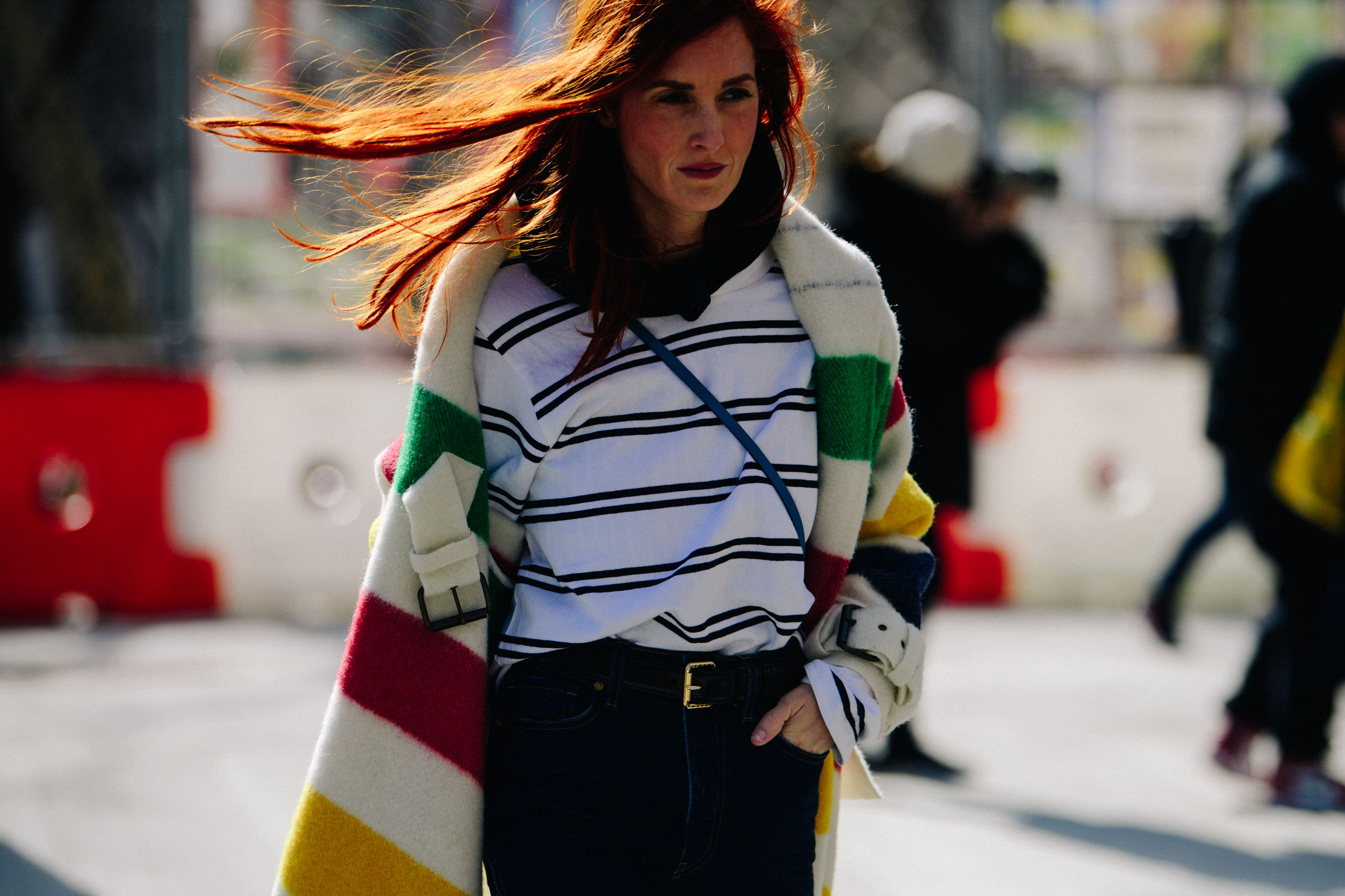 Woman wearing long colourful coat