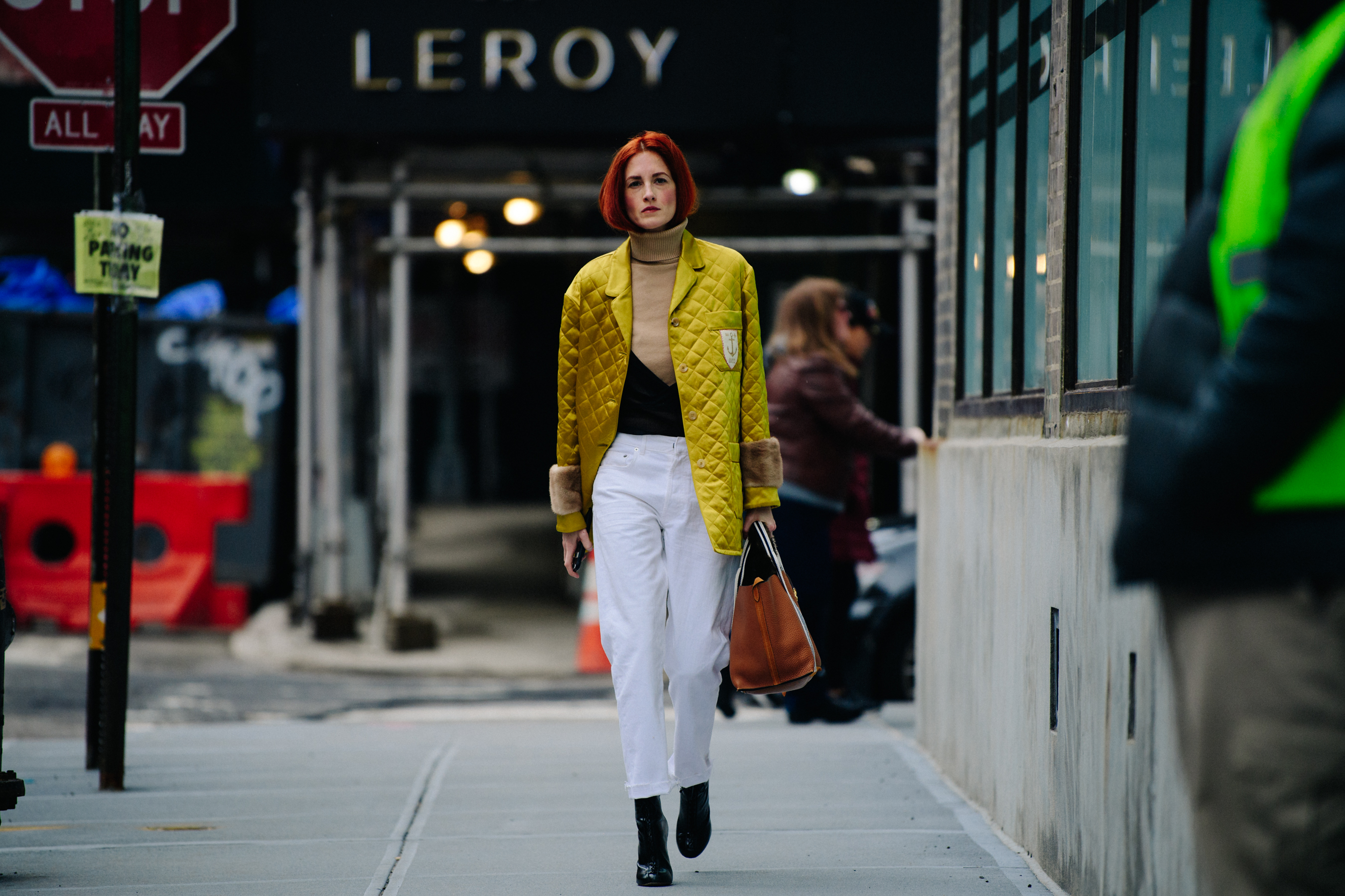 Woman wearing yellow quilted jacket
