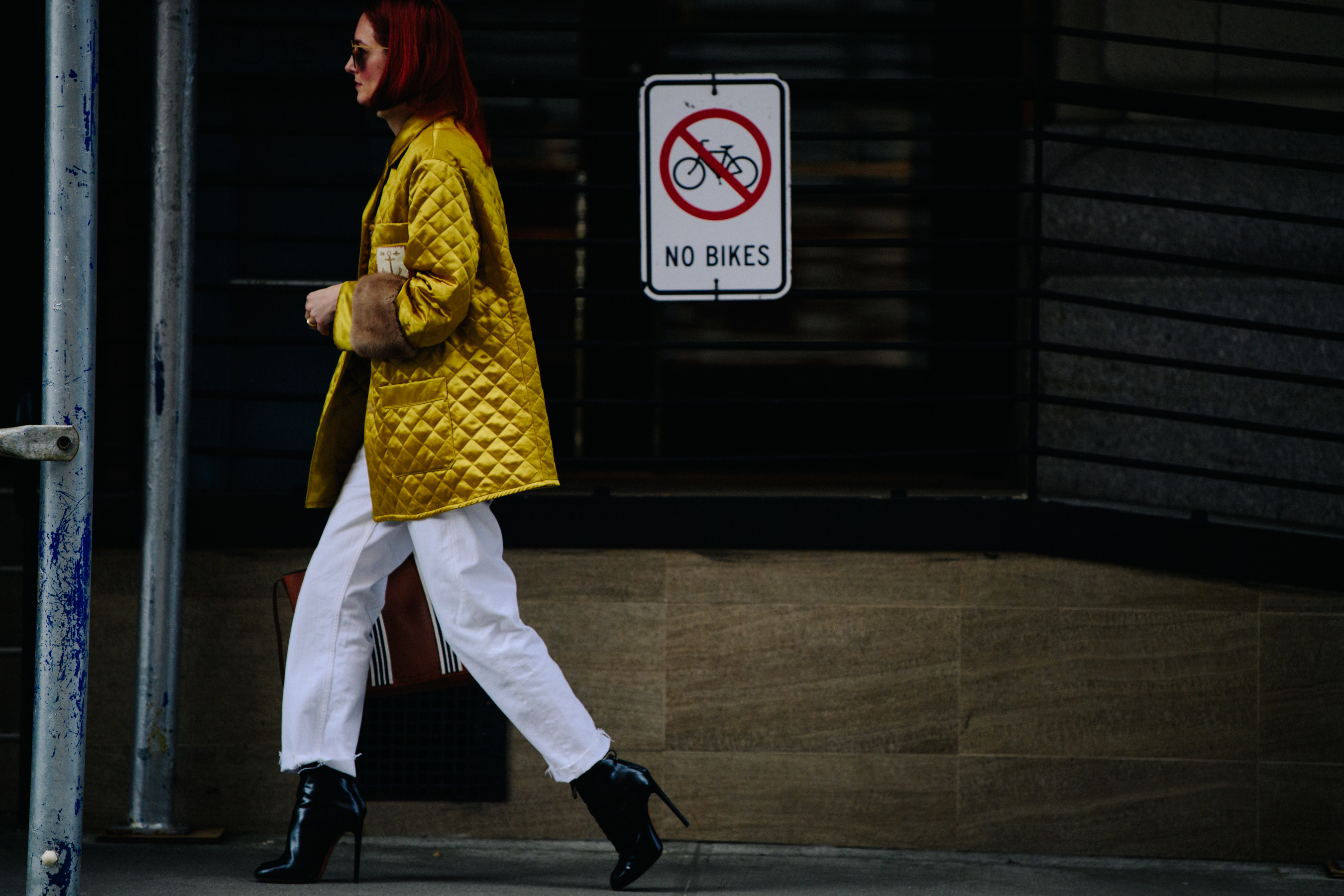 Woman wearing yellow quilted jacket