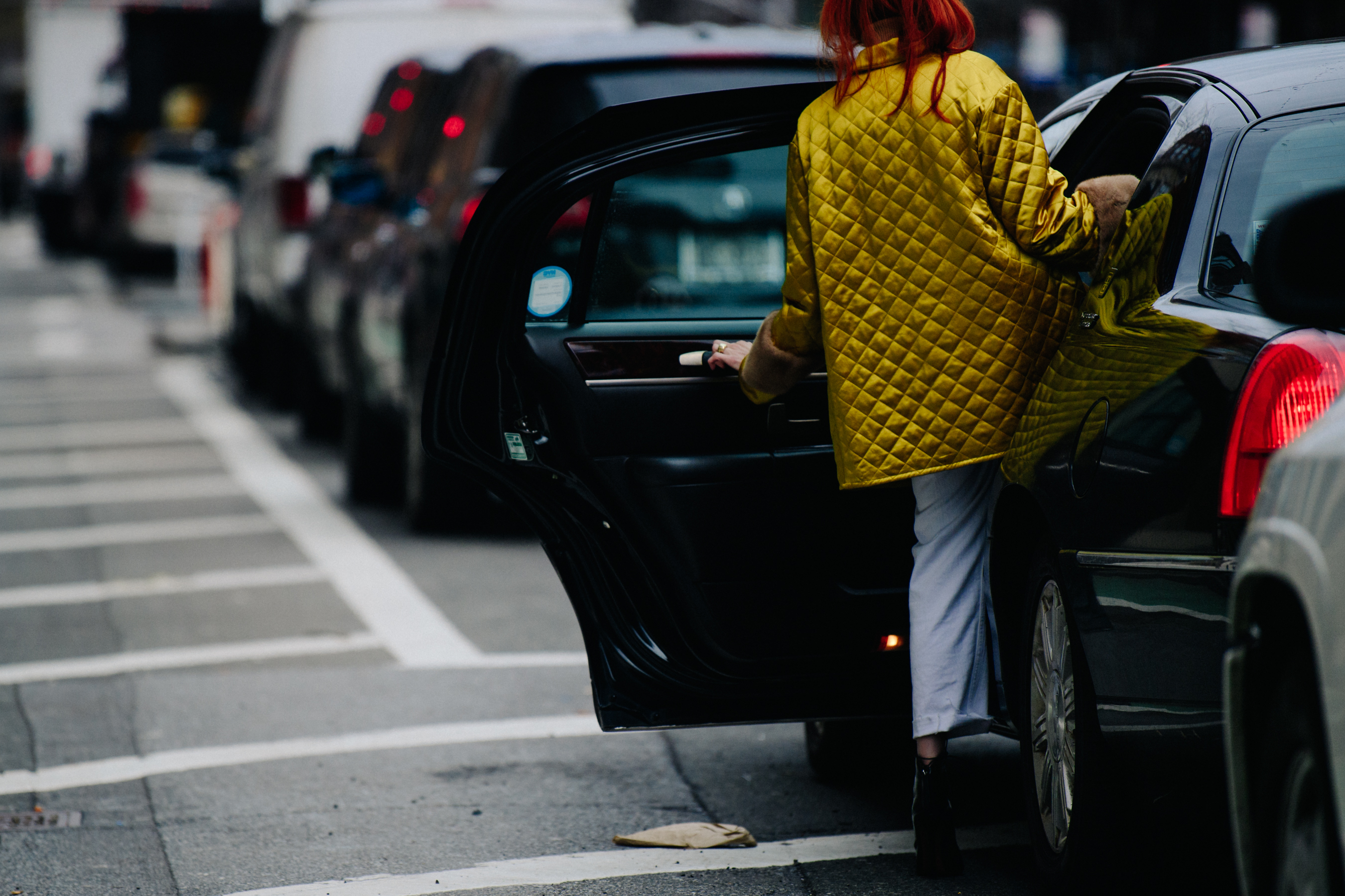 Woman wearing yellow quilted jacket