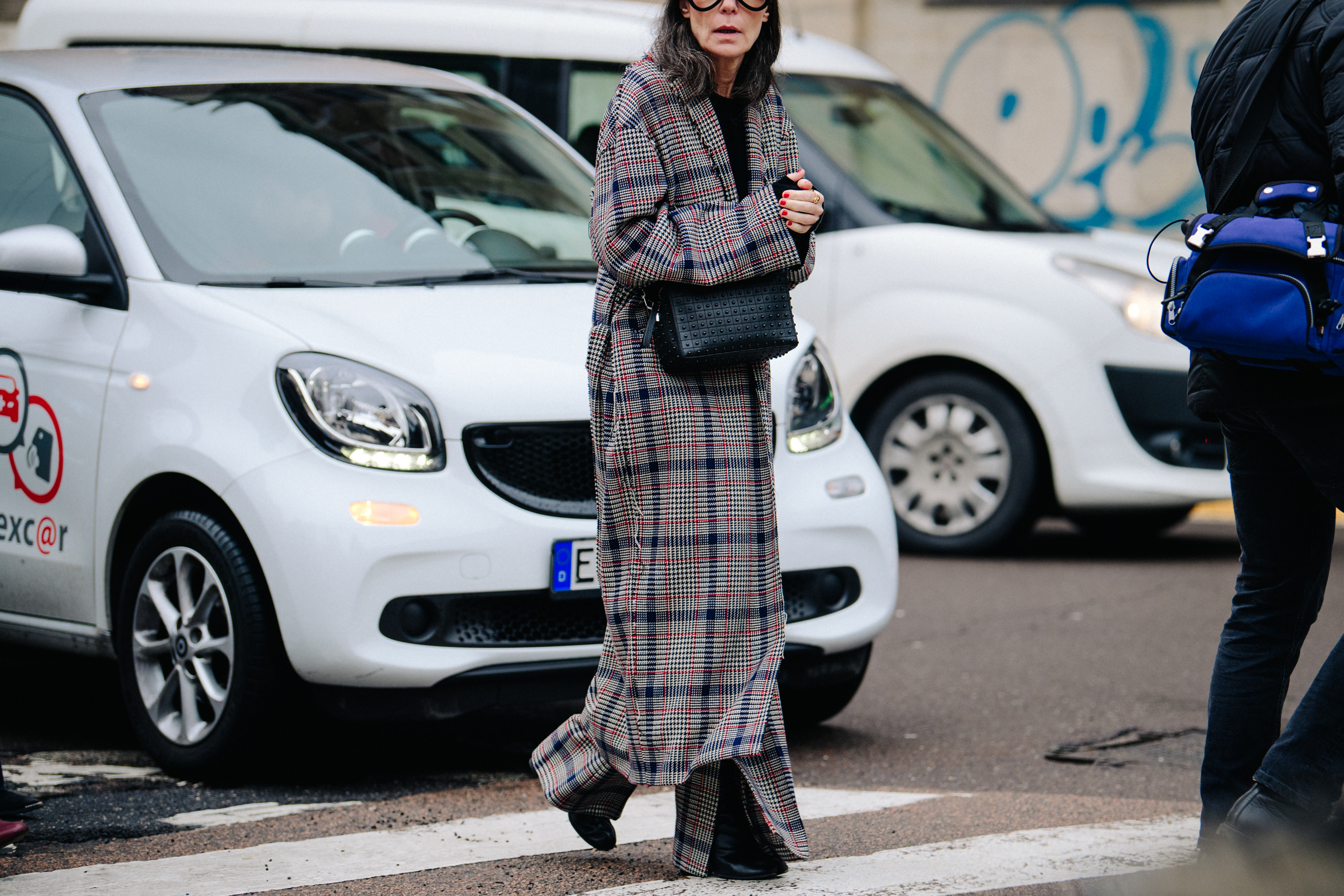 Woman wearing long check coat