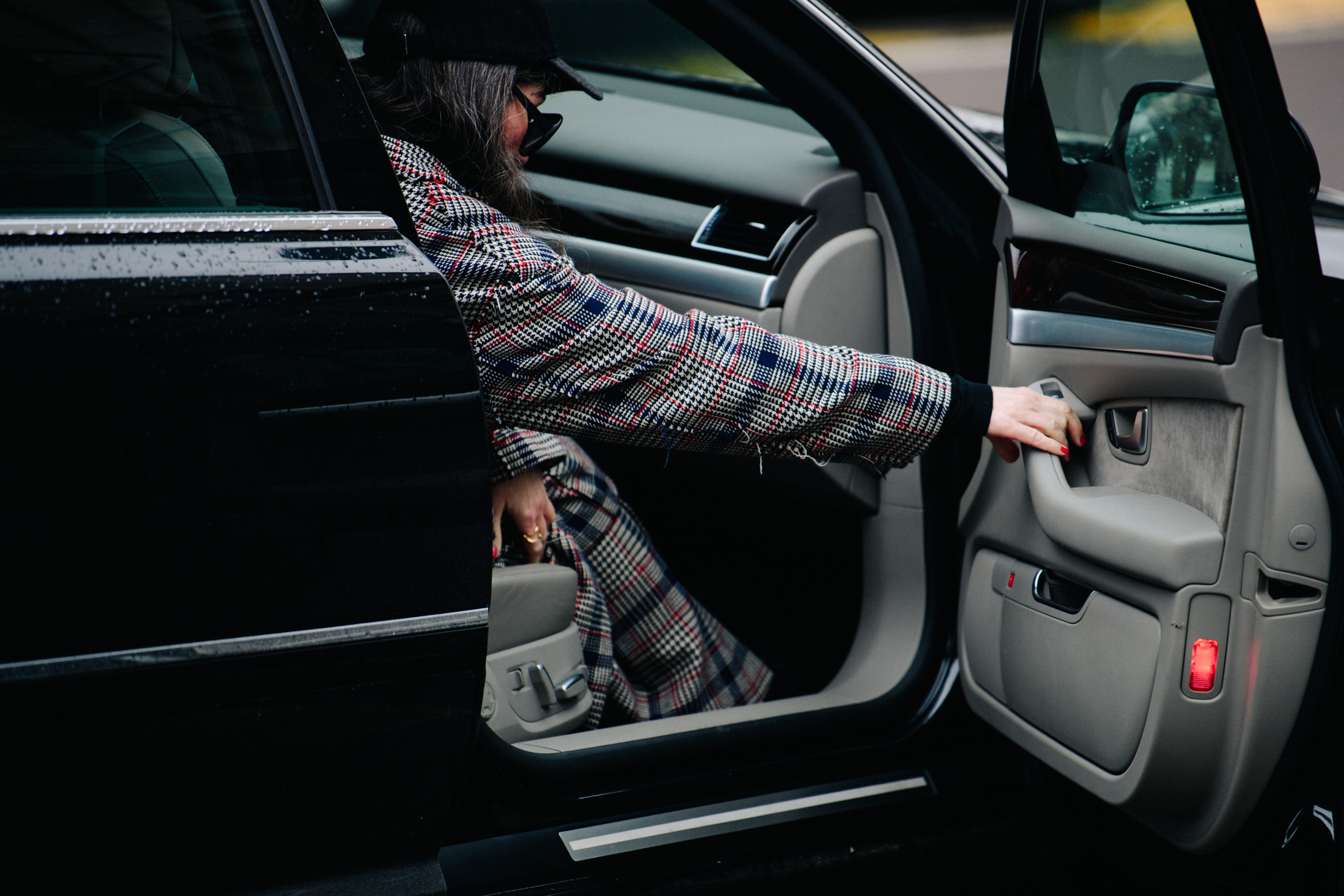 Woman wearing long check coat