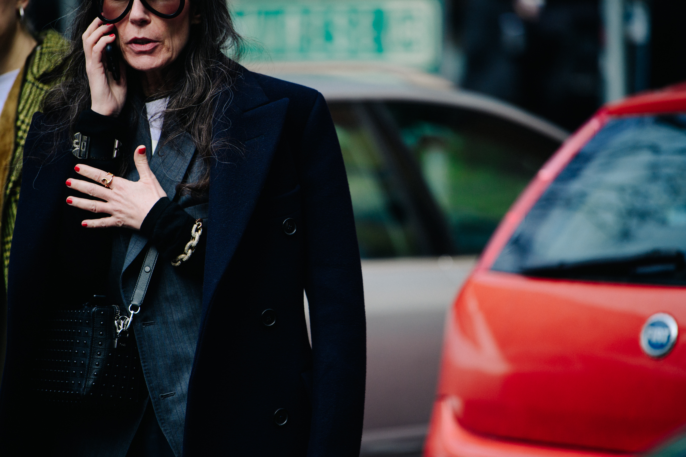 Woman wearing thick black glasses