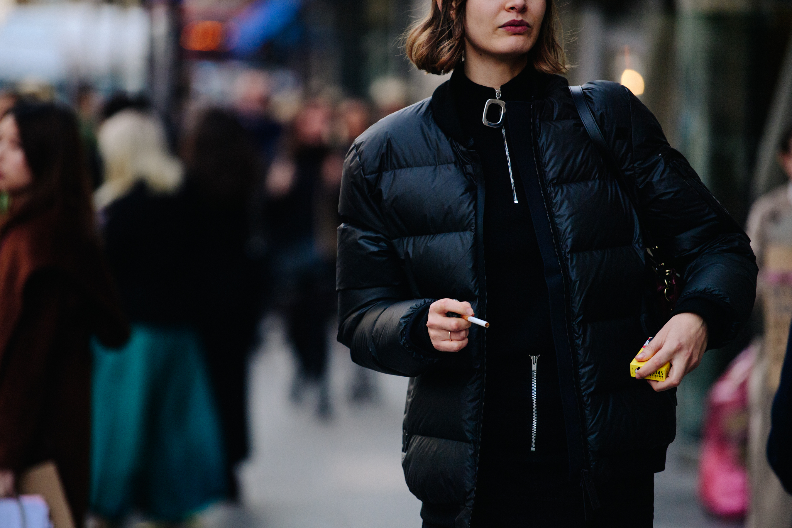 Woman wearing black JW Anderson top