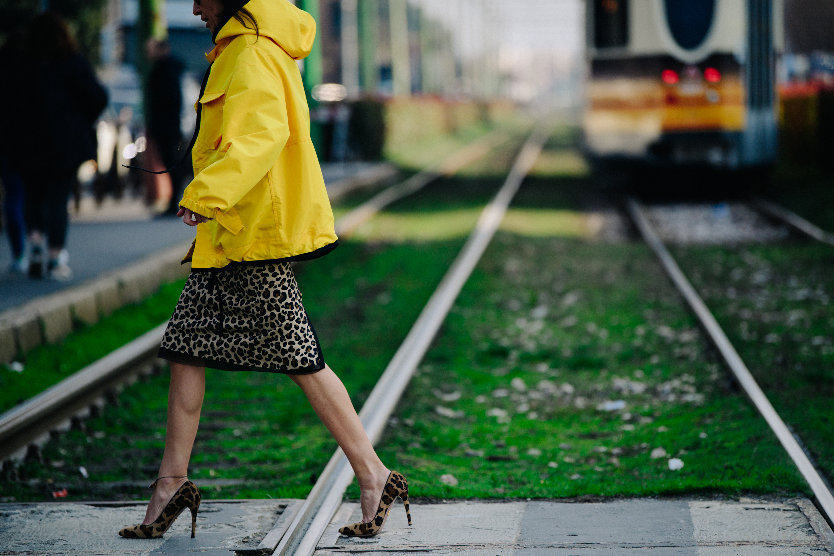 Woman wearing yellow sports jacket