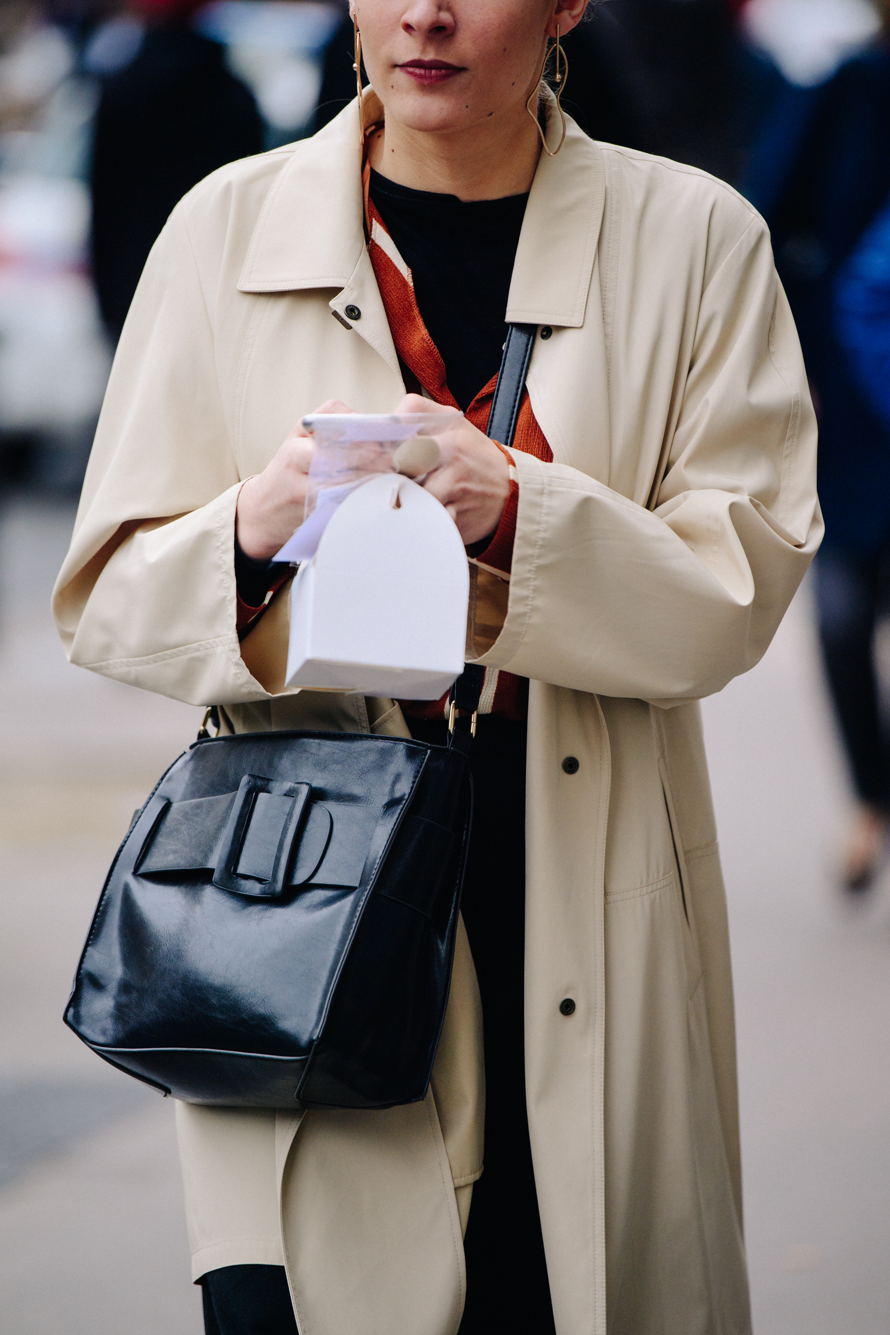 Woman wearing tan coat