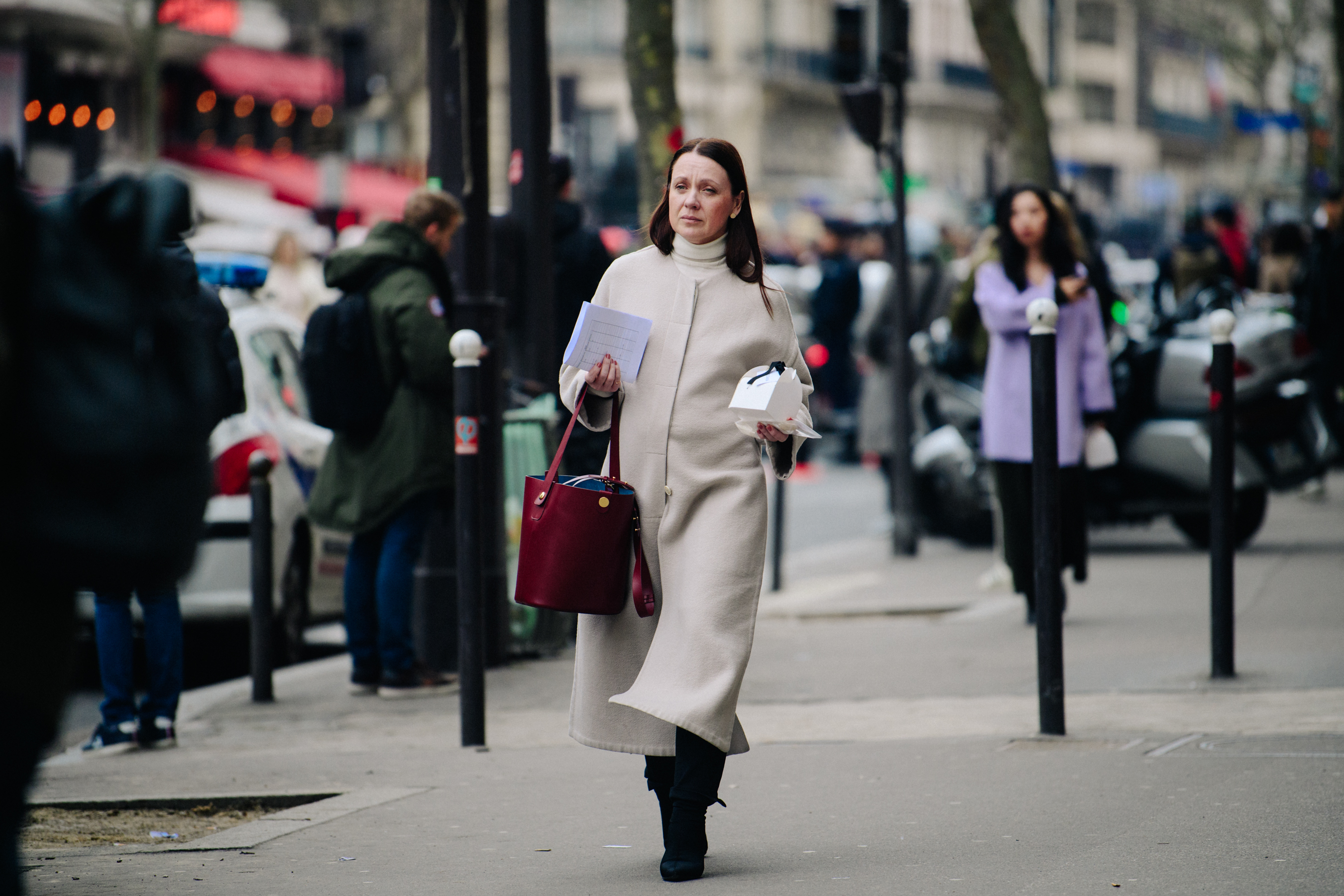 Woman wearing pale wool coat