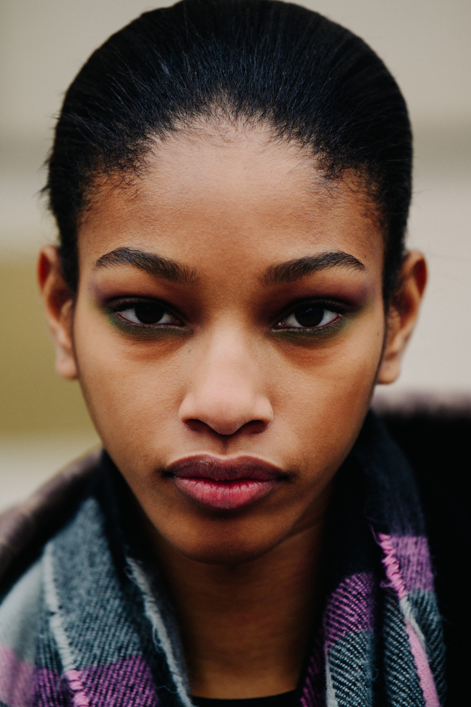 Portrait of model wearing green eye shadow