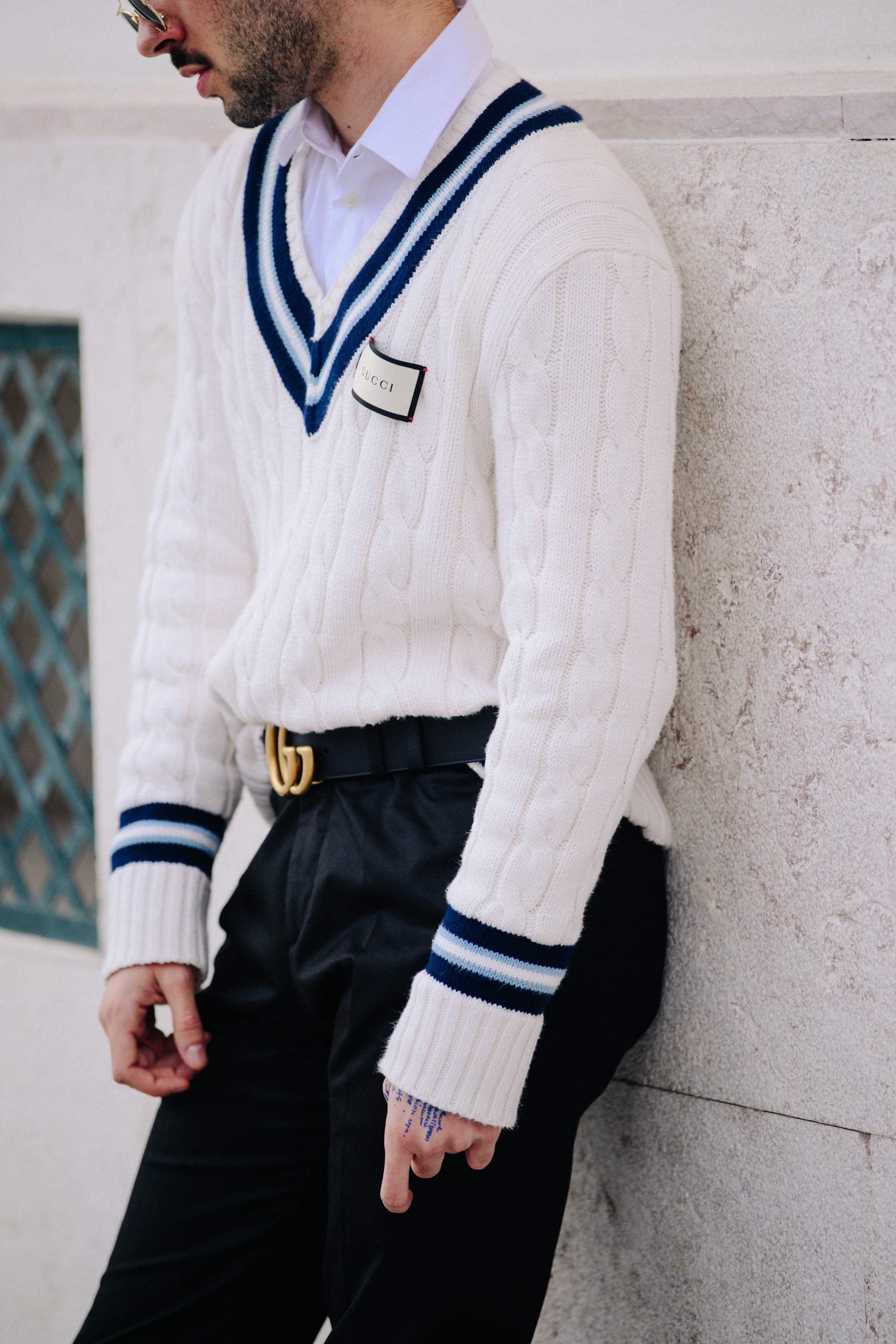 Man wearing white Gucci jumper