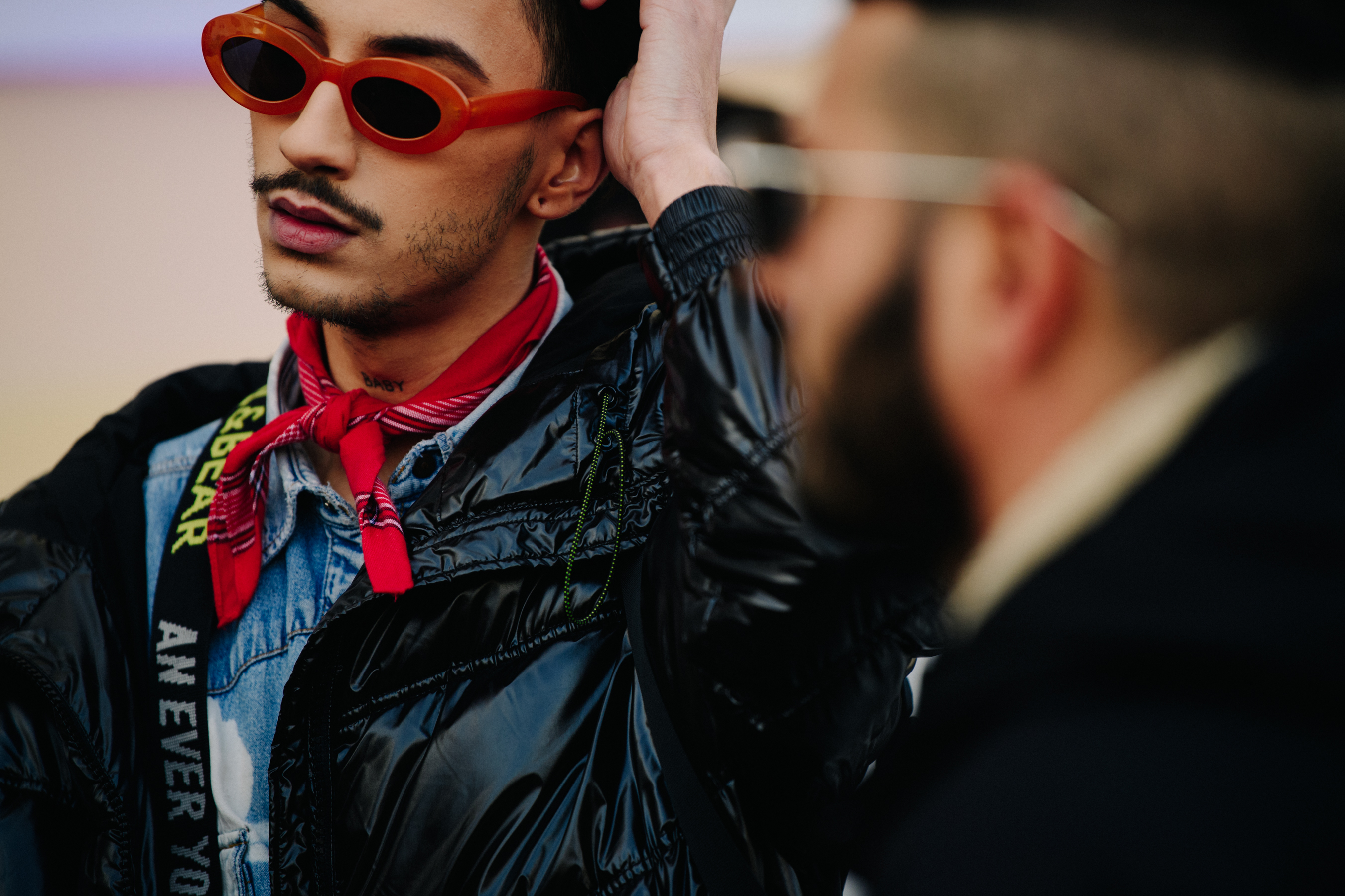 Man wearing orange sunglasses
