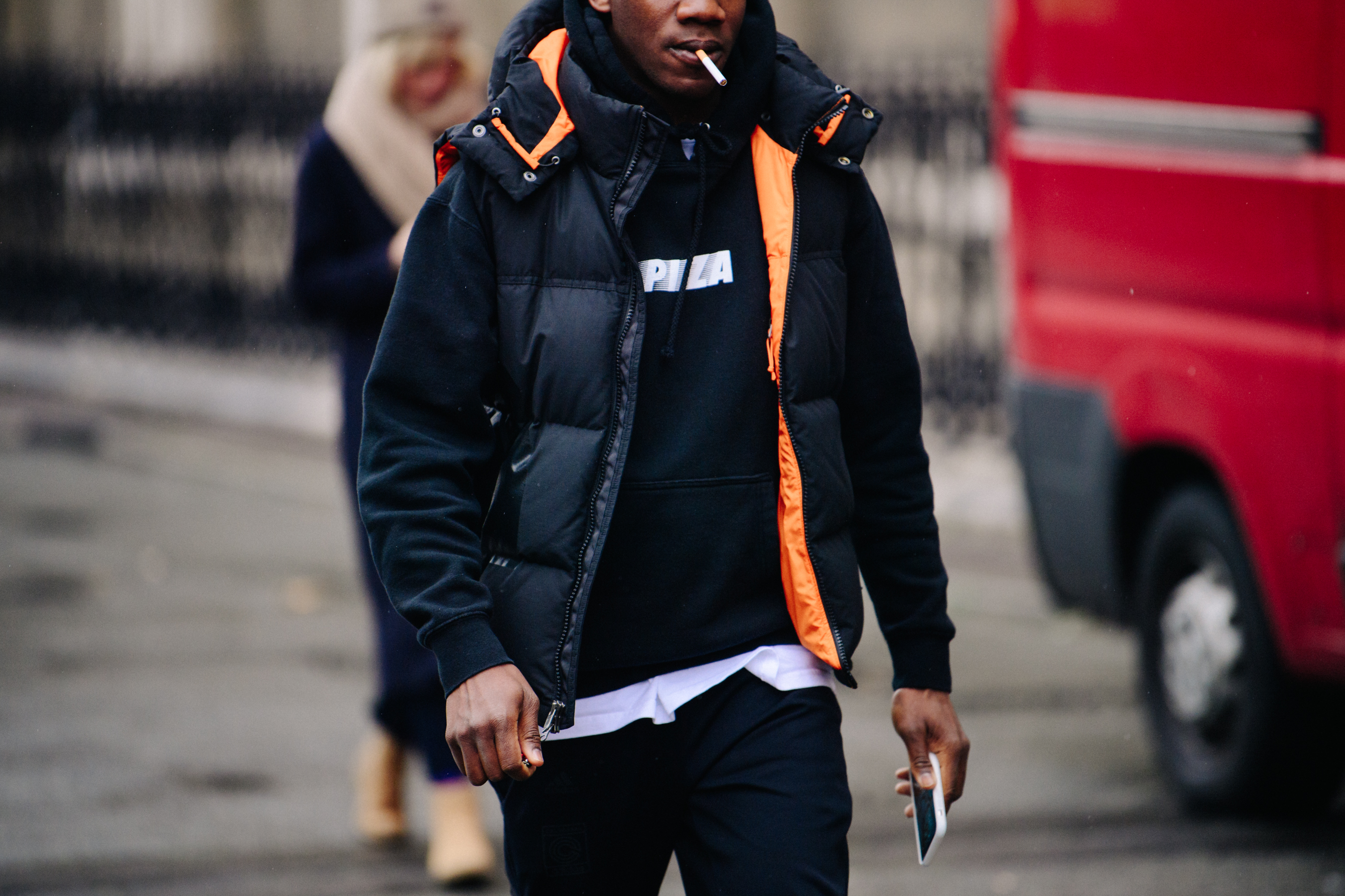 Man wearing black hoodie and coat