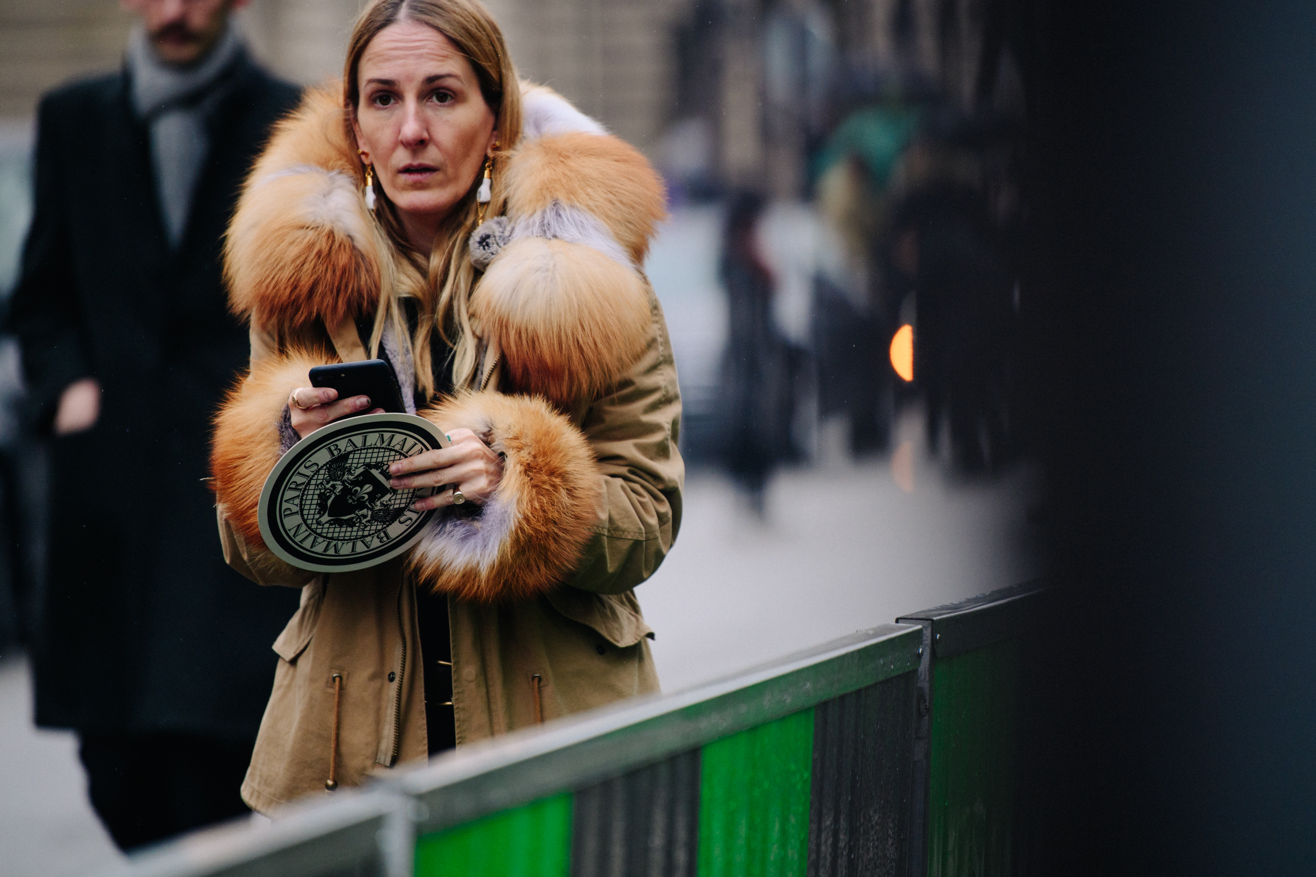 Woman wearing fur trim coat
