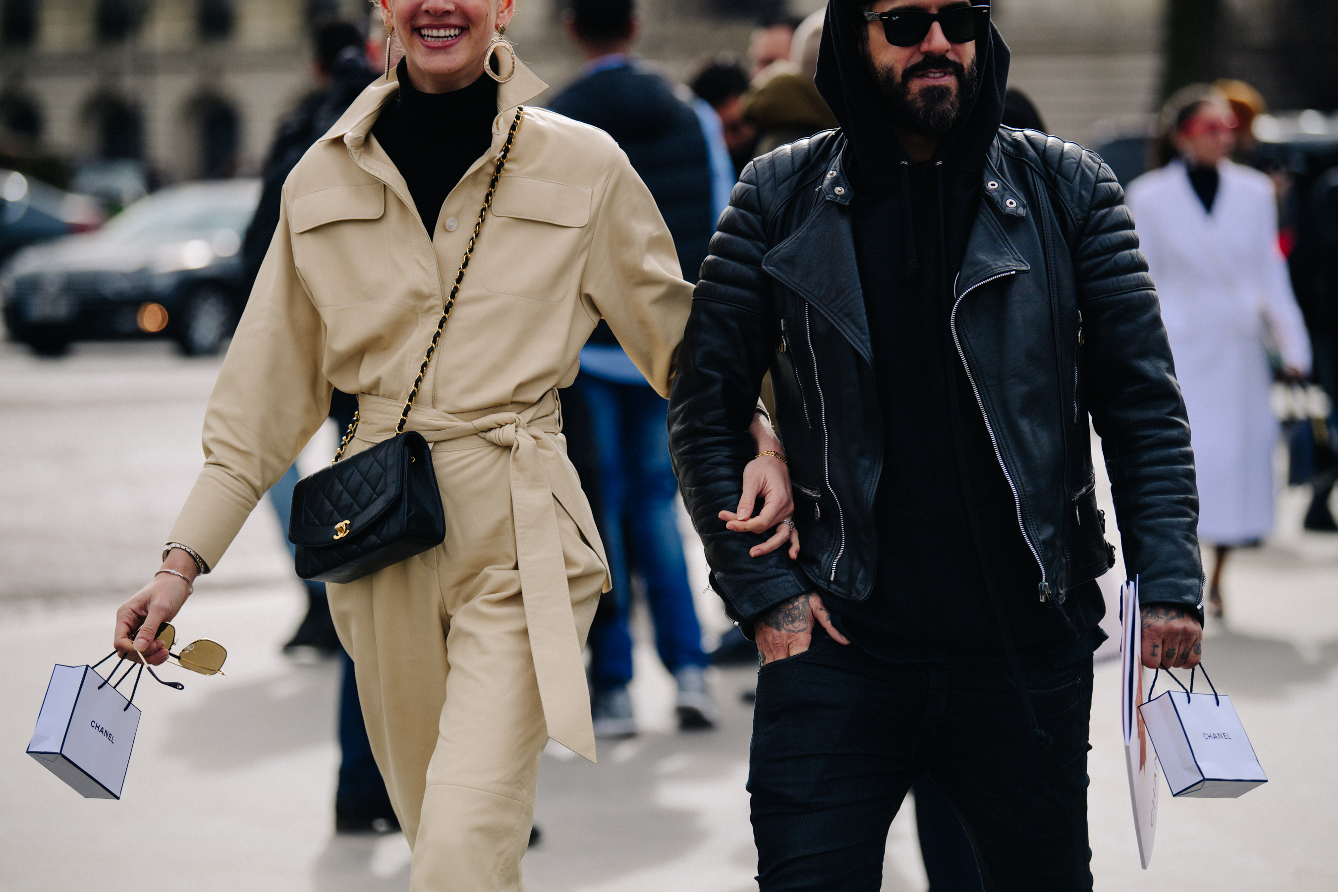 Couple carrying Chanel bags