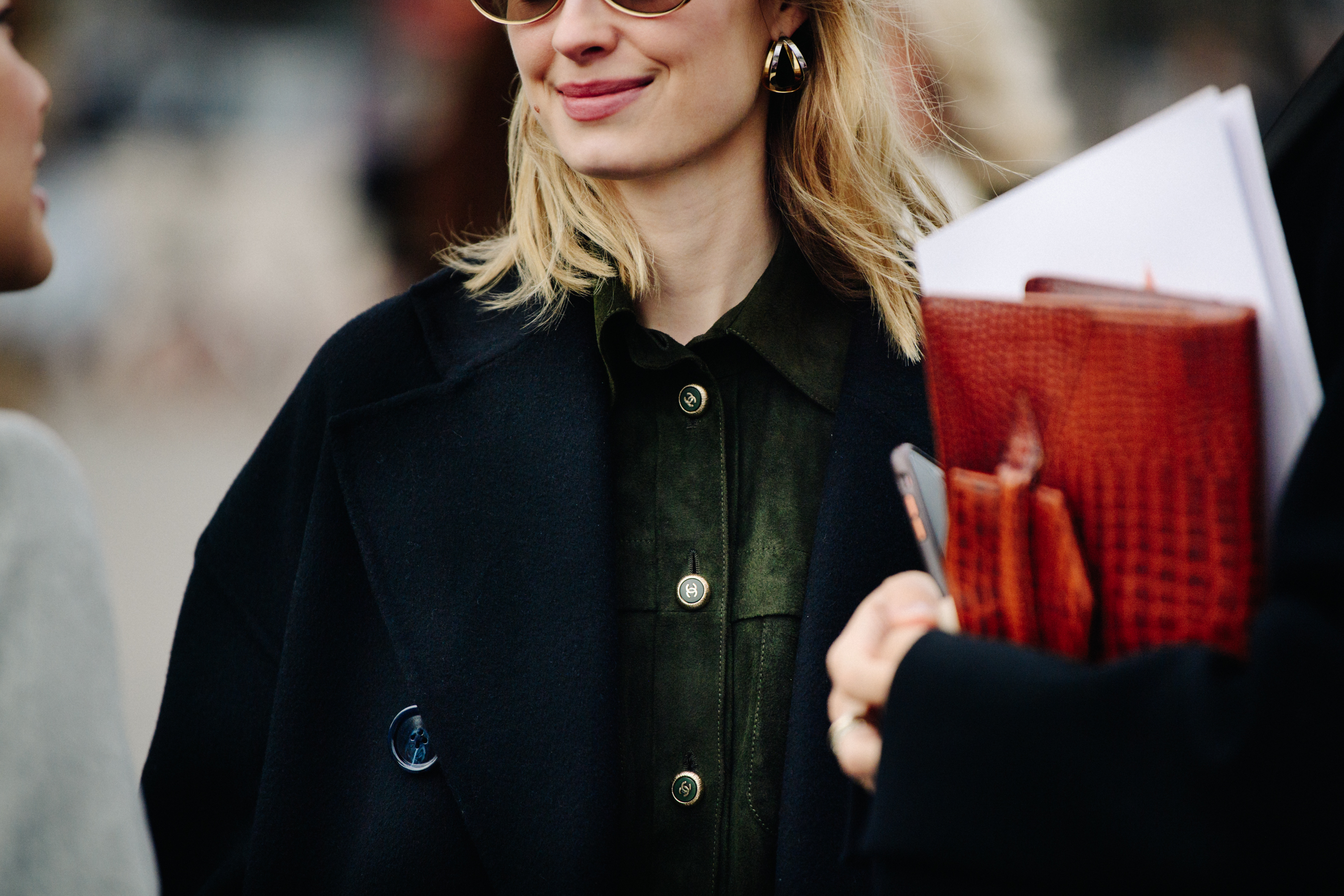Woman wearing green Chanel shirt